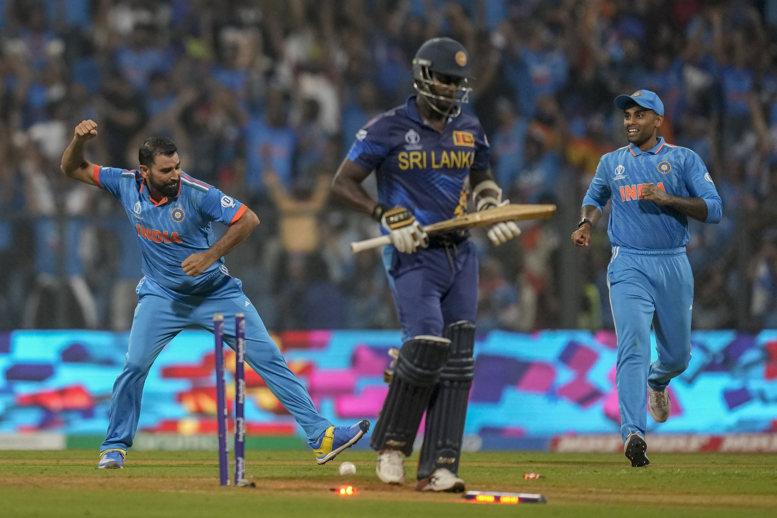 India's Mohammed Shami celebrates the dismissal of Sri Lanka's Angelo Mathews.