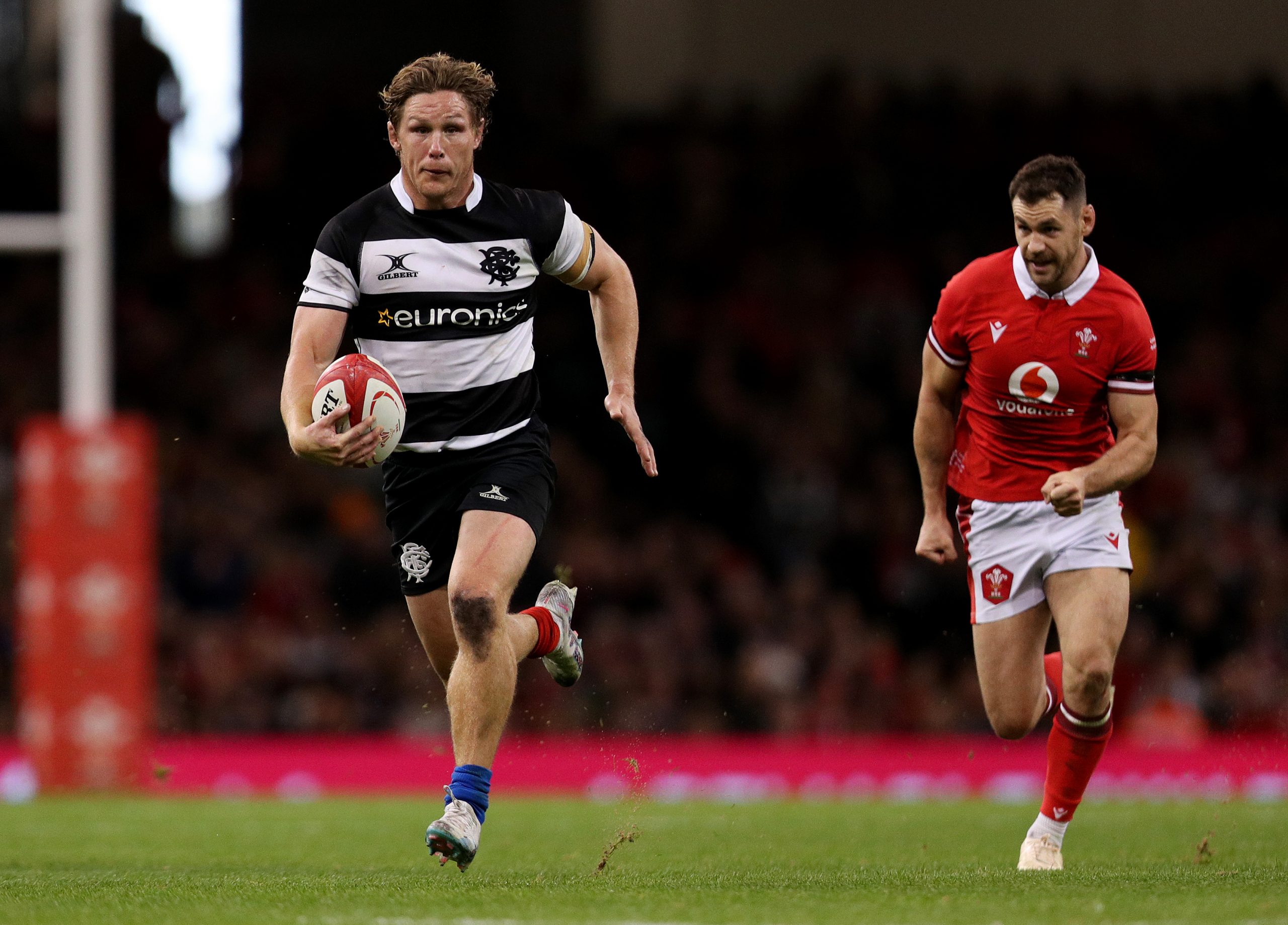 Michael Hooper of the Barbarians runs with the ball.