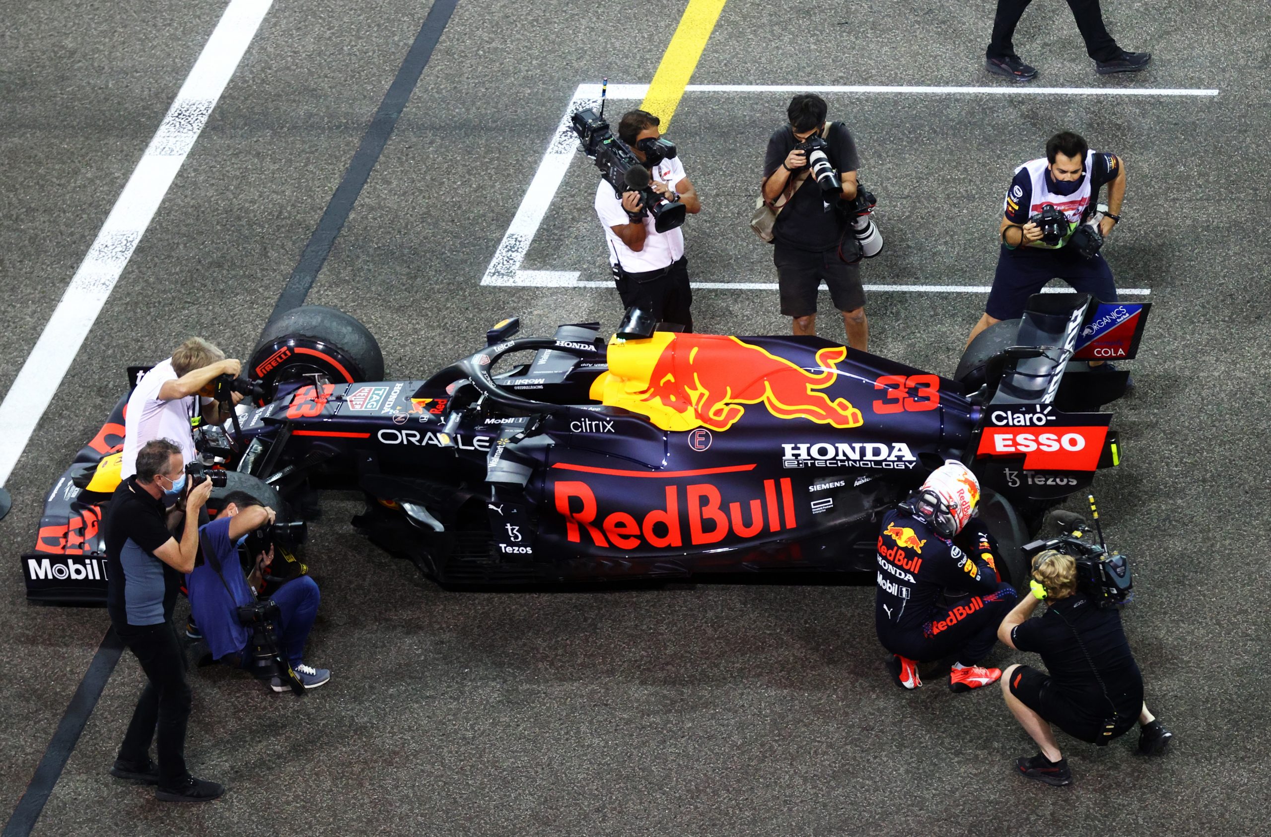 An emotional Max Verstappen pictured next to his Red Bull after winning the 2021 Formula 1 world championship.