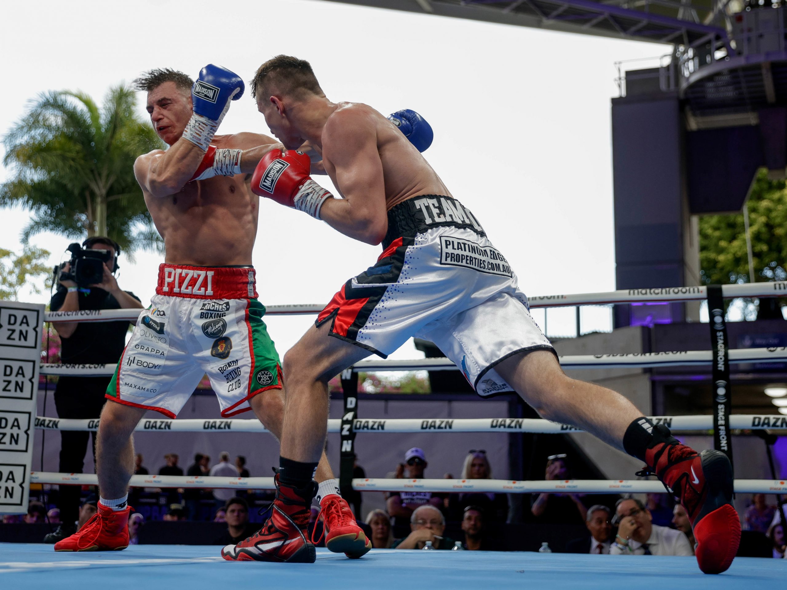 BRISBANE, AUSTRALIA - OCTOBER 15: Dylan Biggs an Mirko Pizzi trade punches during their bout at Southbank Plaza on October 15, 2022 in Brisbane, Australia. (Photo by Russell Freeman/Getty Images)