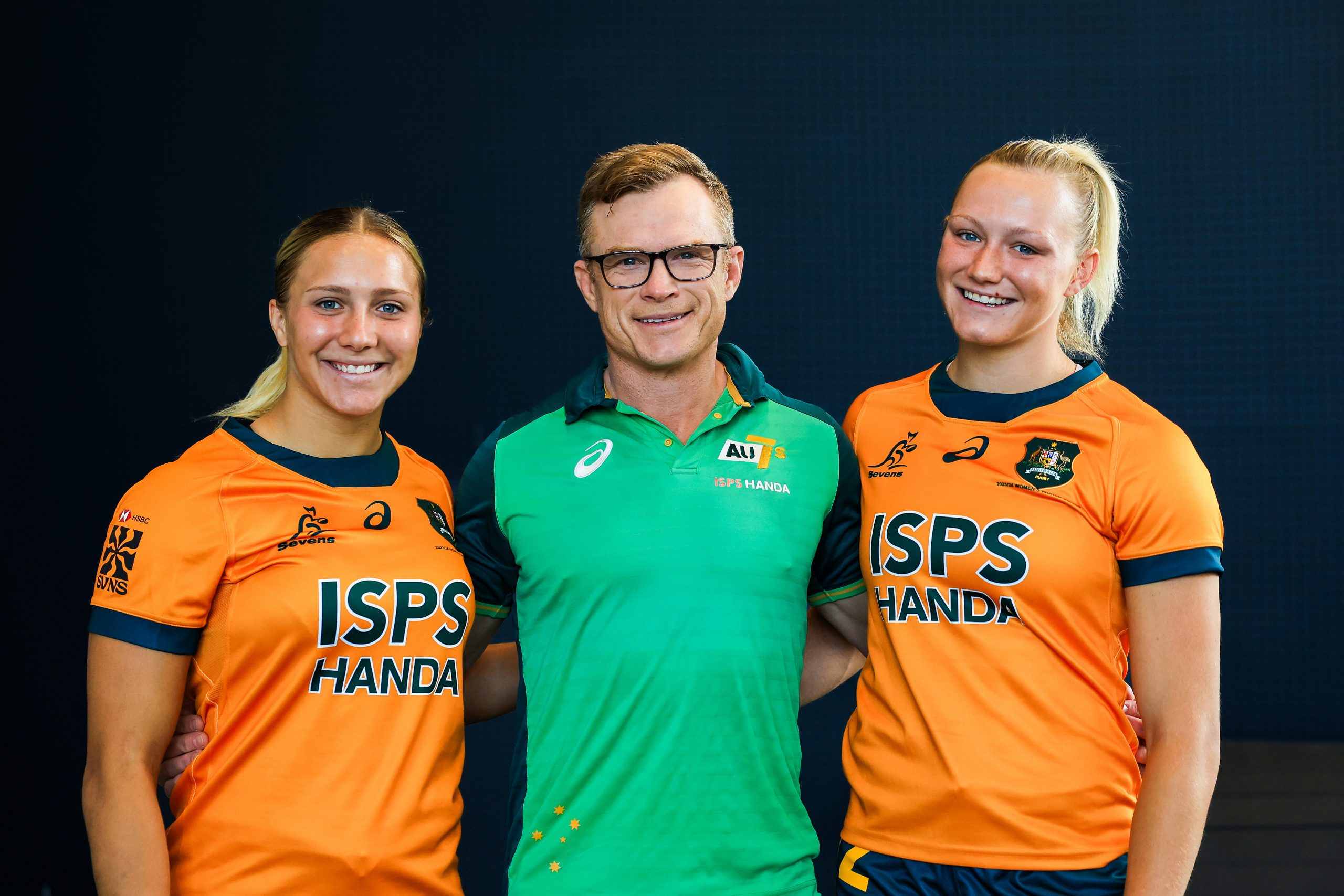 Teagan Levi, Tim Walsh and Maddison Levi pose for a photo during a Rugby Australia media opportunity.