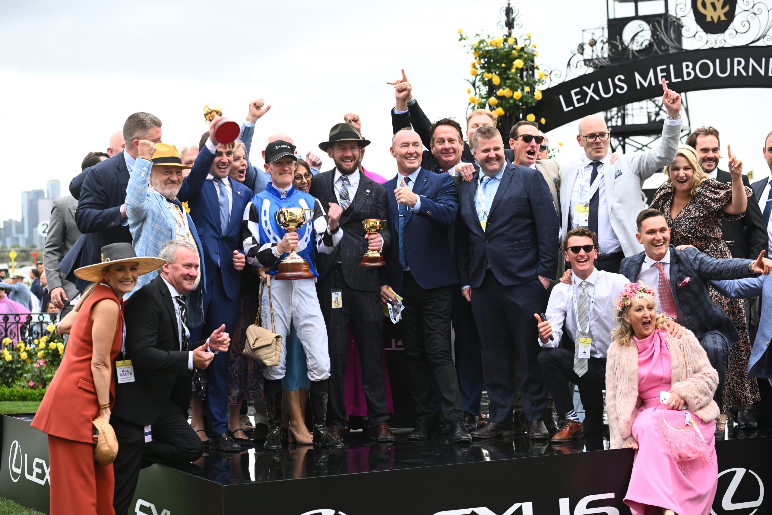 Trainers David Eustace, Ciaron Maher and jockey Mark Zahra pose with connections after Gold Trip won Race 7, the Lexus Melbourne Cup.