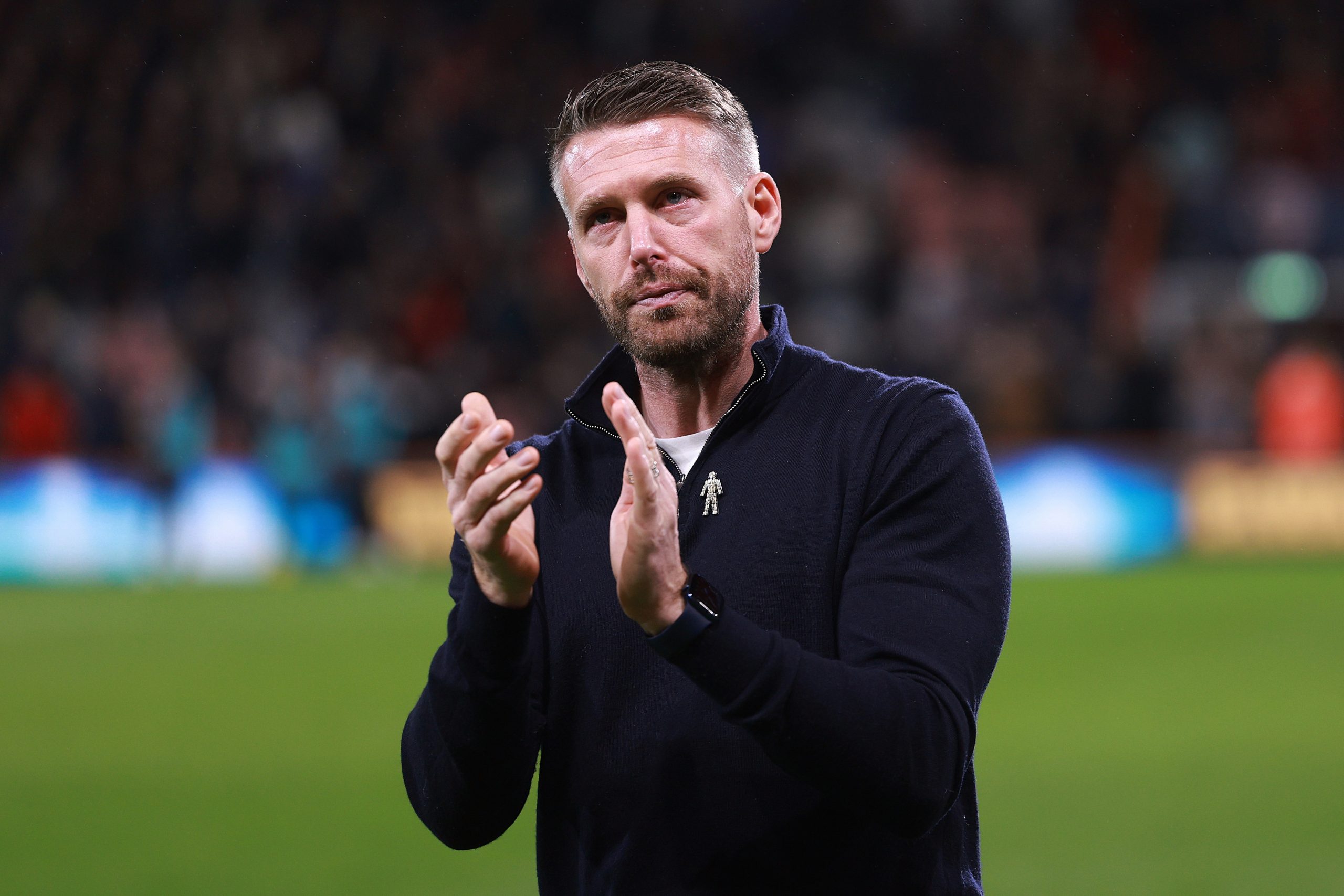 Rob Edwards, Manager of Luton Town, applaud the fans after coming out of the tunnel after the match is suspended after Tom Lockyer of Luton Town (not pictured) collapsed during the Premier League match between AFC Bournemouth and Luton Town at Vitality Stadium on December 16, 2023 in Bournemouth, England. (Photo by Warren Little/Getty Images)