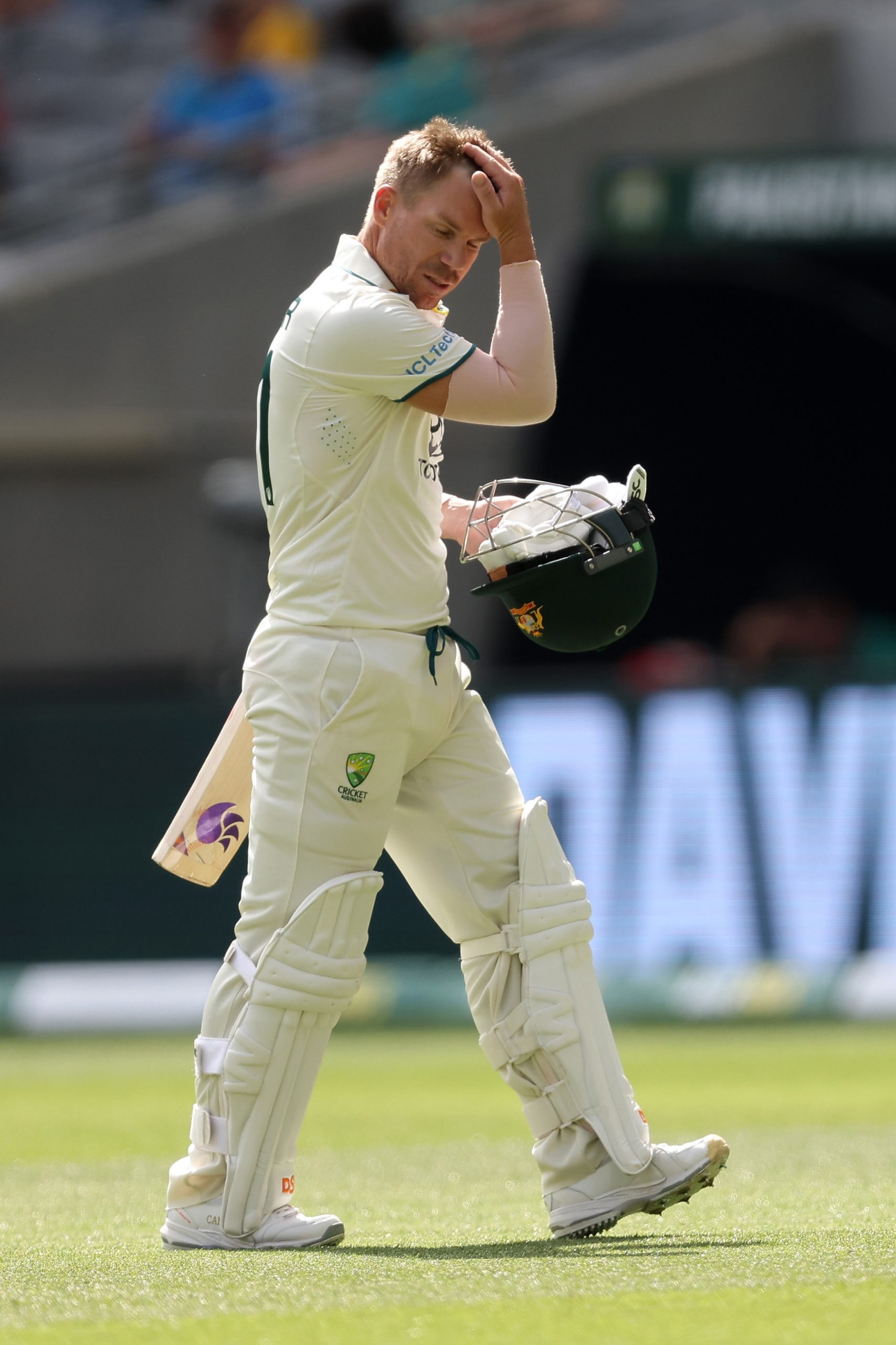 PERTH, AUSTRALIA - DECEMBER 16: David Warner of Australia looks dejected after being dismissed by Khurram Shahzad of Pakistan during day three of the Men's First Test match between Australia and Pakistan at Optus Stadium on December 16, 2023 in Perth, Australia (Photo by Paul Kane/Getty Images)