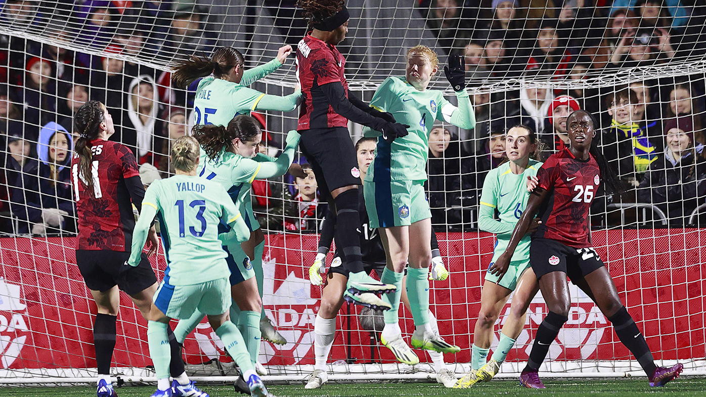 Canada's Kadeisha Buchanan and Australia's Clare Polkinghorne head the ball during their friendly match.