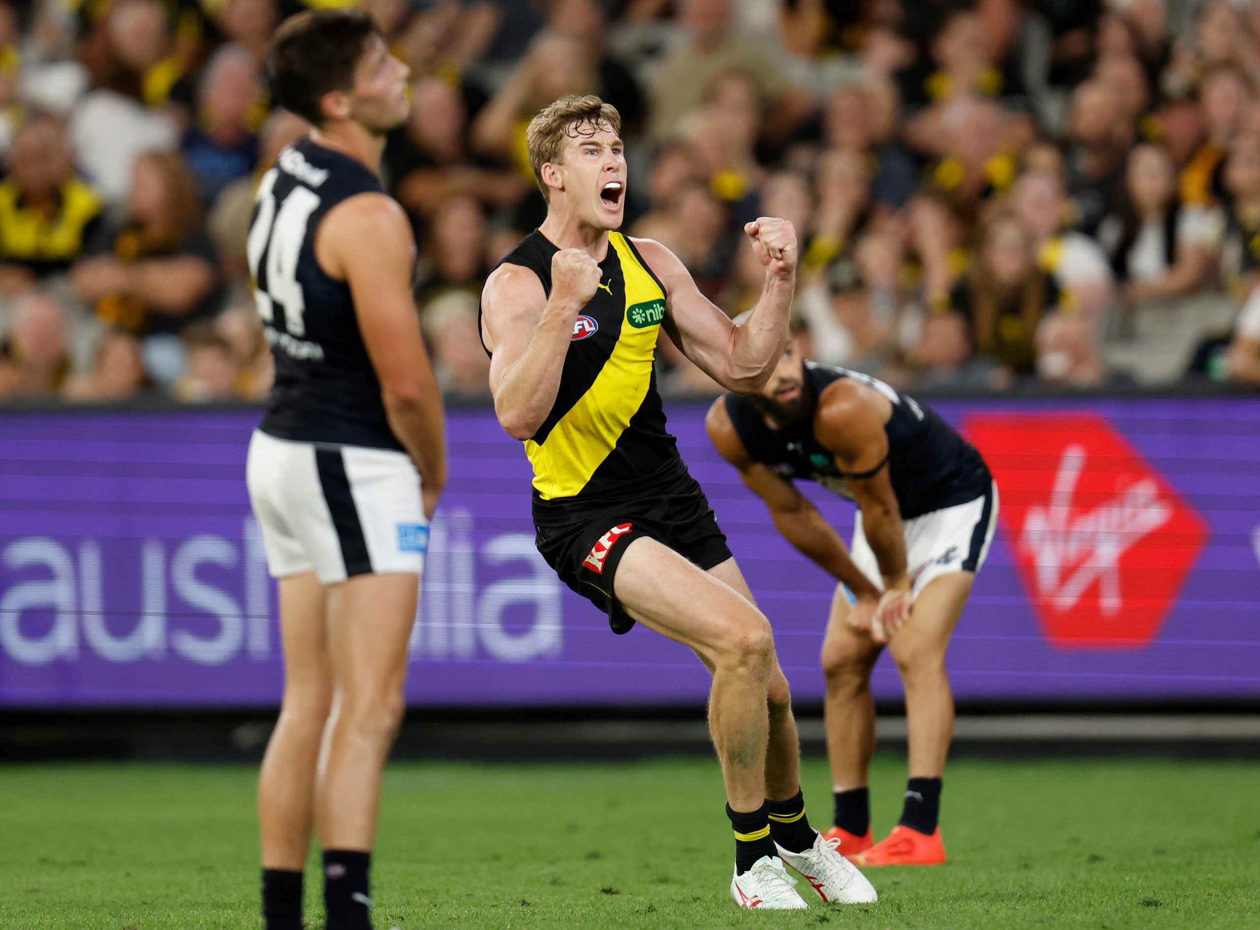 MELBOURNE, AUSTRALIA - MARCH 16: Tom Lynch of the Tigers celebrates a goal during the 2023 AFL Round 01 match between the Richmond Tigers and the Carlton Blues at the Melbourne Cricket Ground on March 16, 2023 in Melbourne, Australia. (Photo by Michael Willson/AFL Photos)