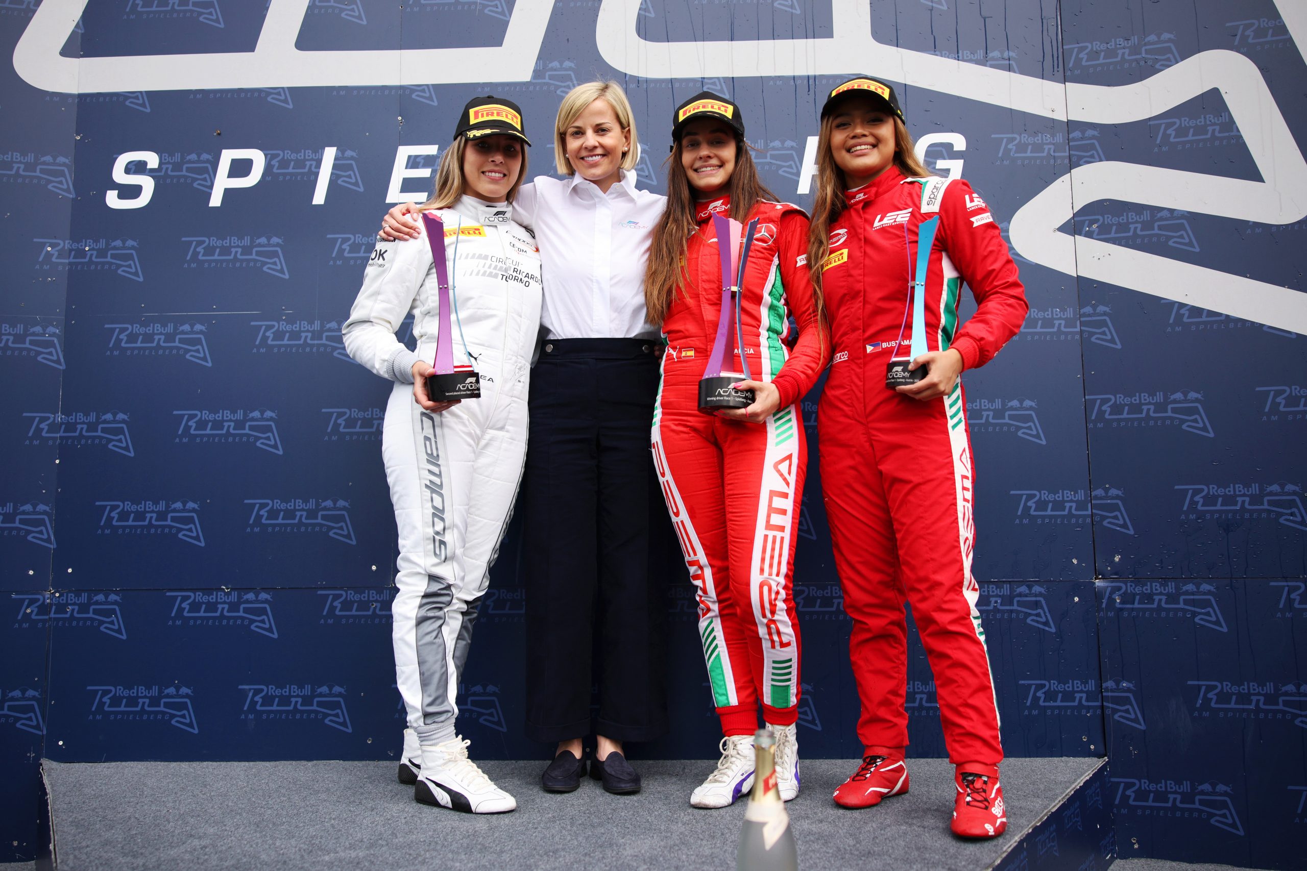 (From left) second placed Nerea Marti, Susie Wolff, the managing director of F1 Academy, race winner Marta Garciam and third placed Bianca Bustamante.