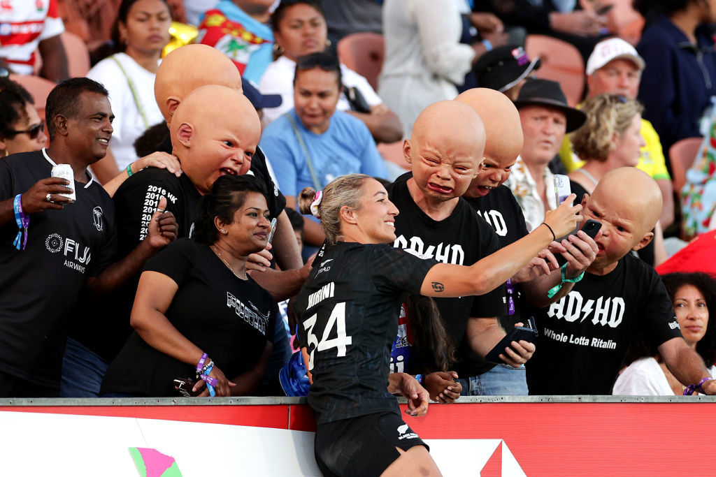 Sarah Hirini of New Zealand takes a selfie with fans in Hamilton.