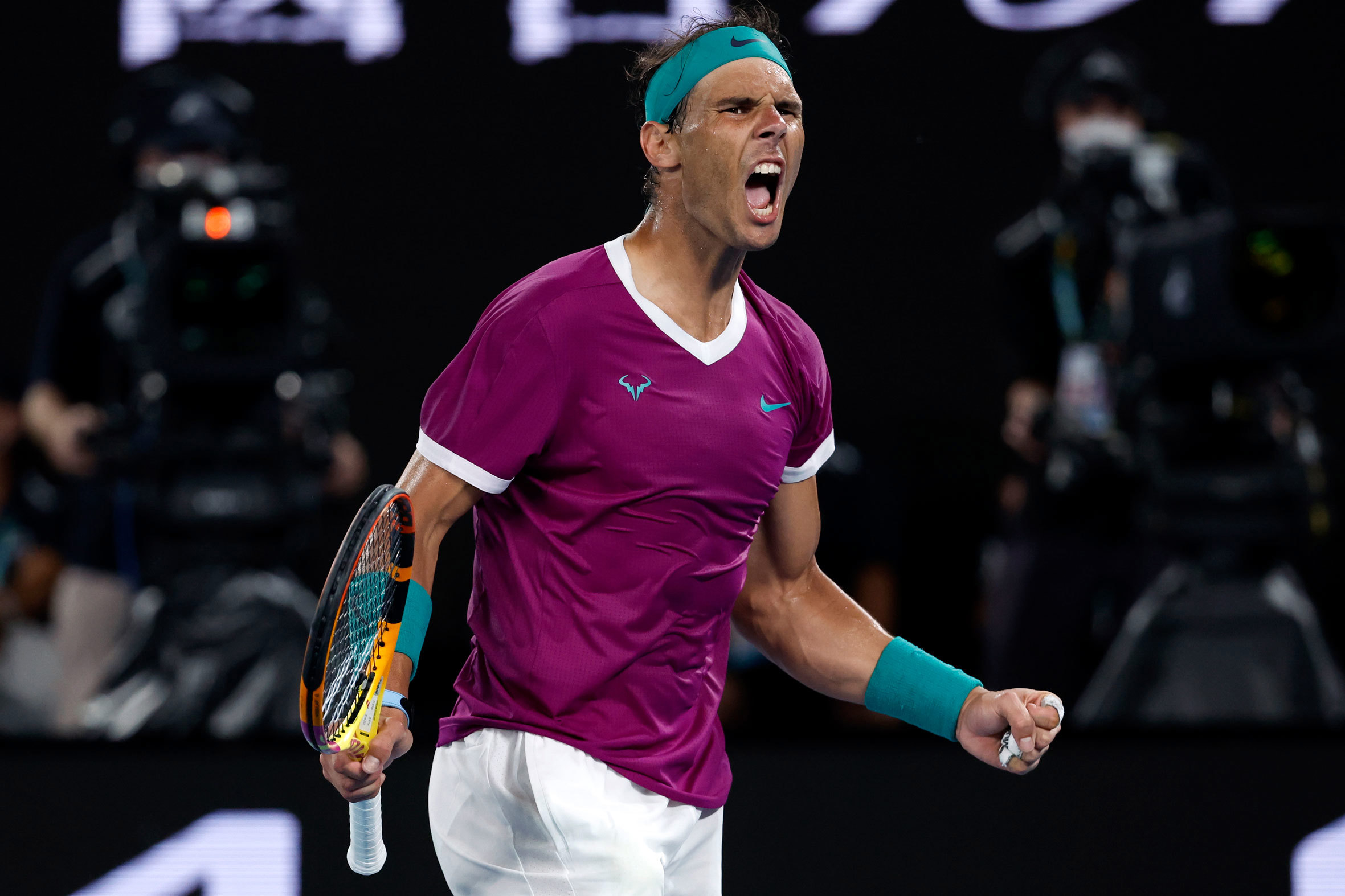 Rafael Nadal of Spain reacts after winning the third set against Daniil Medvedev of Russia during the men's singles final at the Australian Open tennis championships in Melbourne, Australia, Sunday, Jan. 30, 2022. 