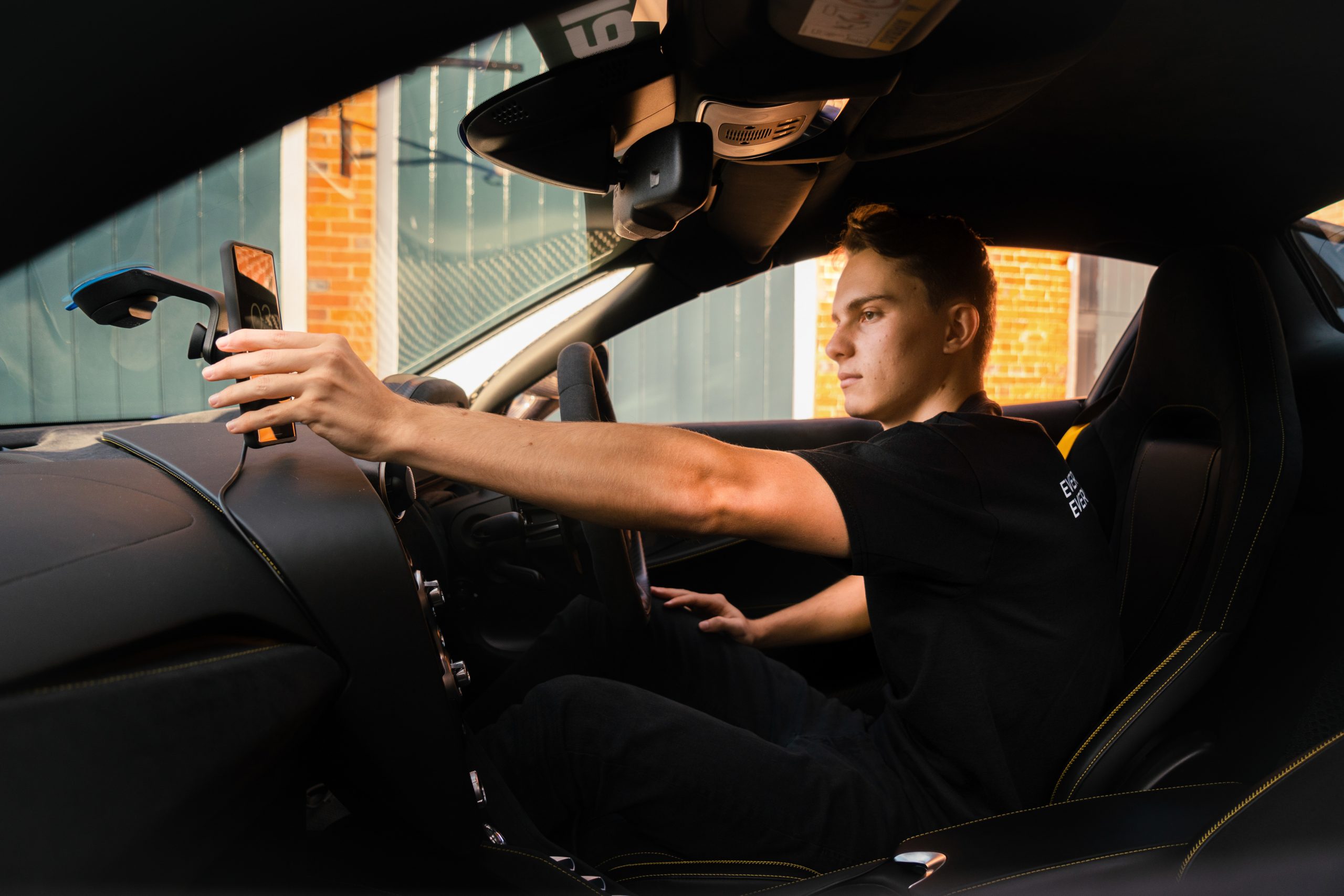 "Get your hands off it" is a joint safety message from Oscar Piasrti and Quad Lock to encourage driver attentiveness.