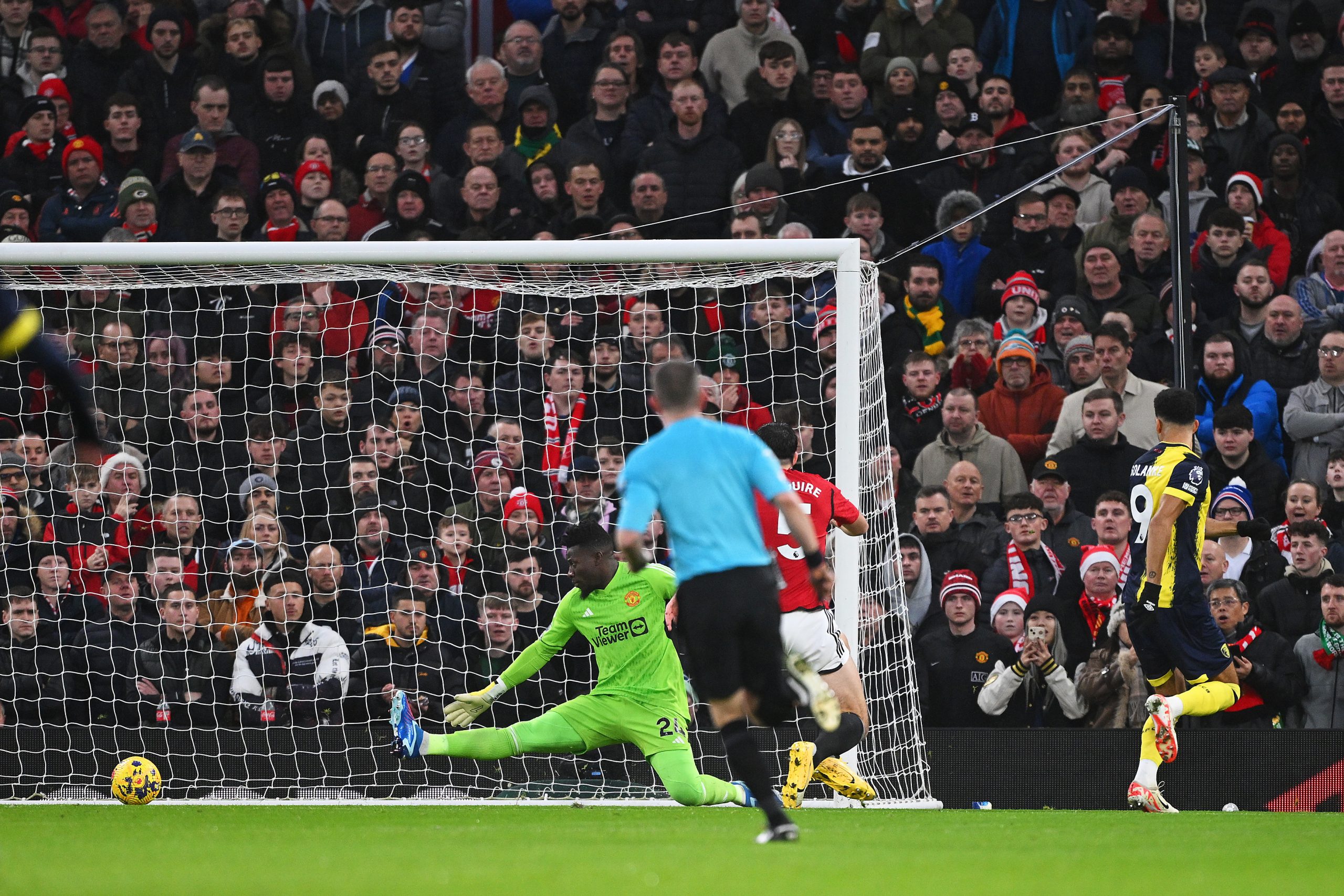 Dominic Solanke of AFC Bournemouth scores their team's first goal during the Premier League match between Manchester United and AFC Bournemouth at Old Trafford on December 09, 2023 in Manchester, England. (Photo by Stu Forster/Getty Images)