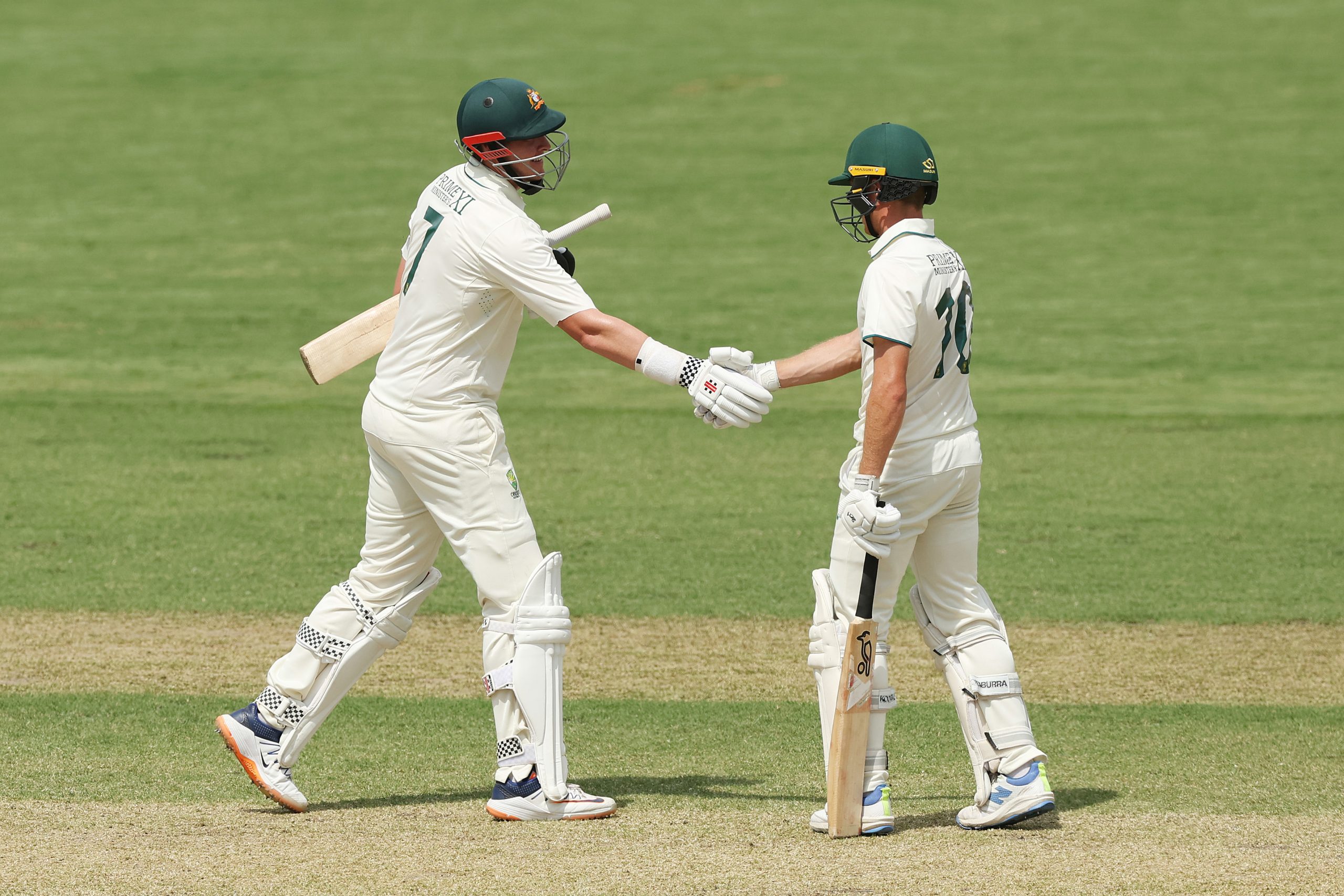 Nathan McSweeney congratulates Matt Renshaw on his century.