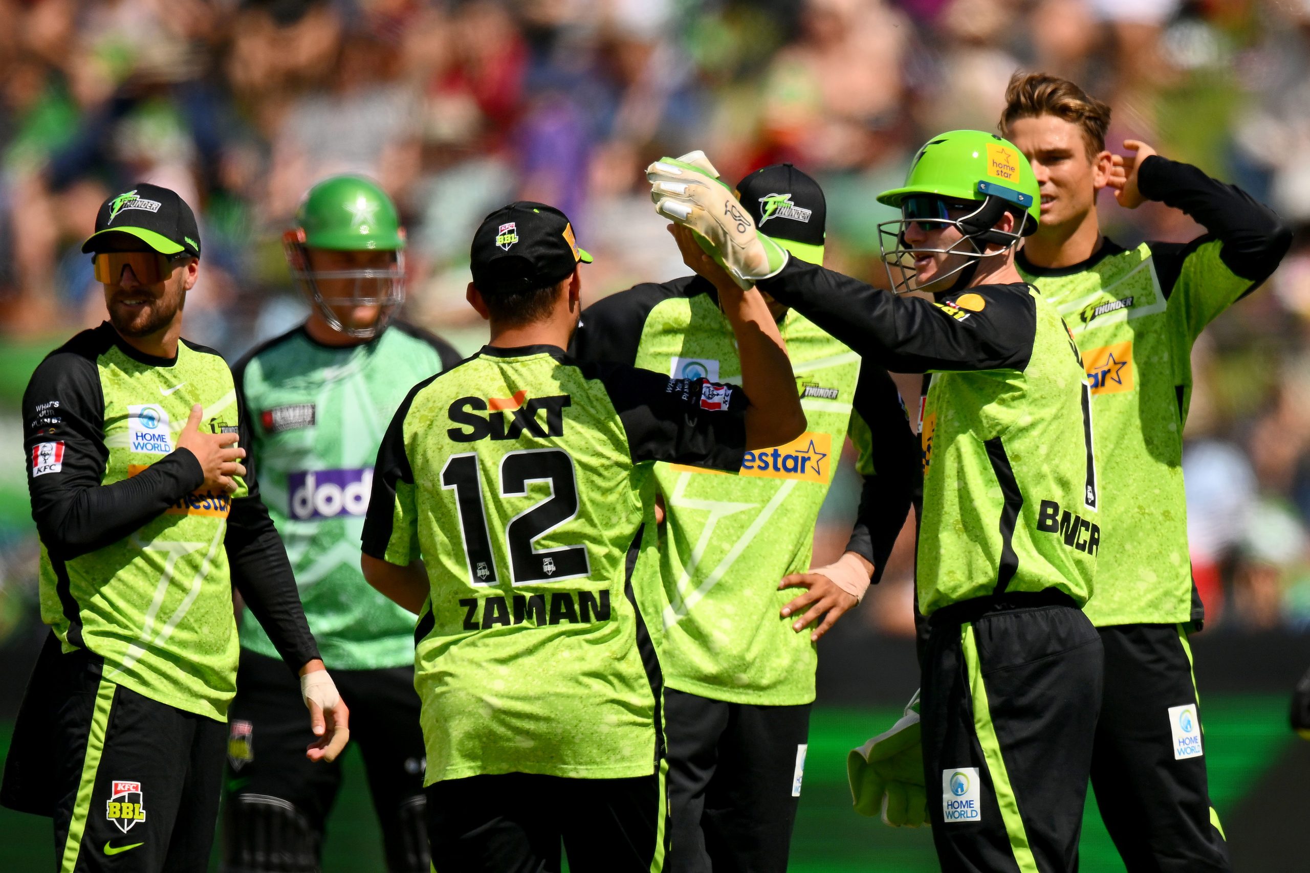 Zaman Khan and Cameron Bancroft celebrate the wicket of Sam Harper.