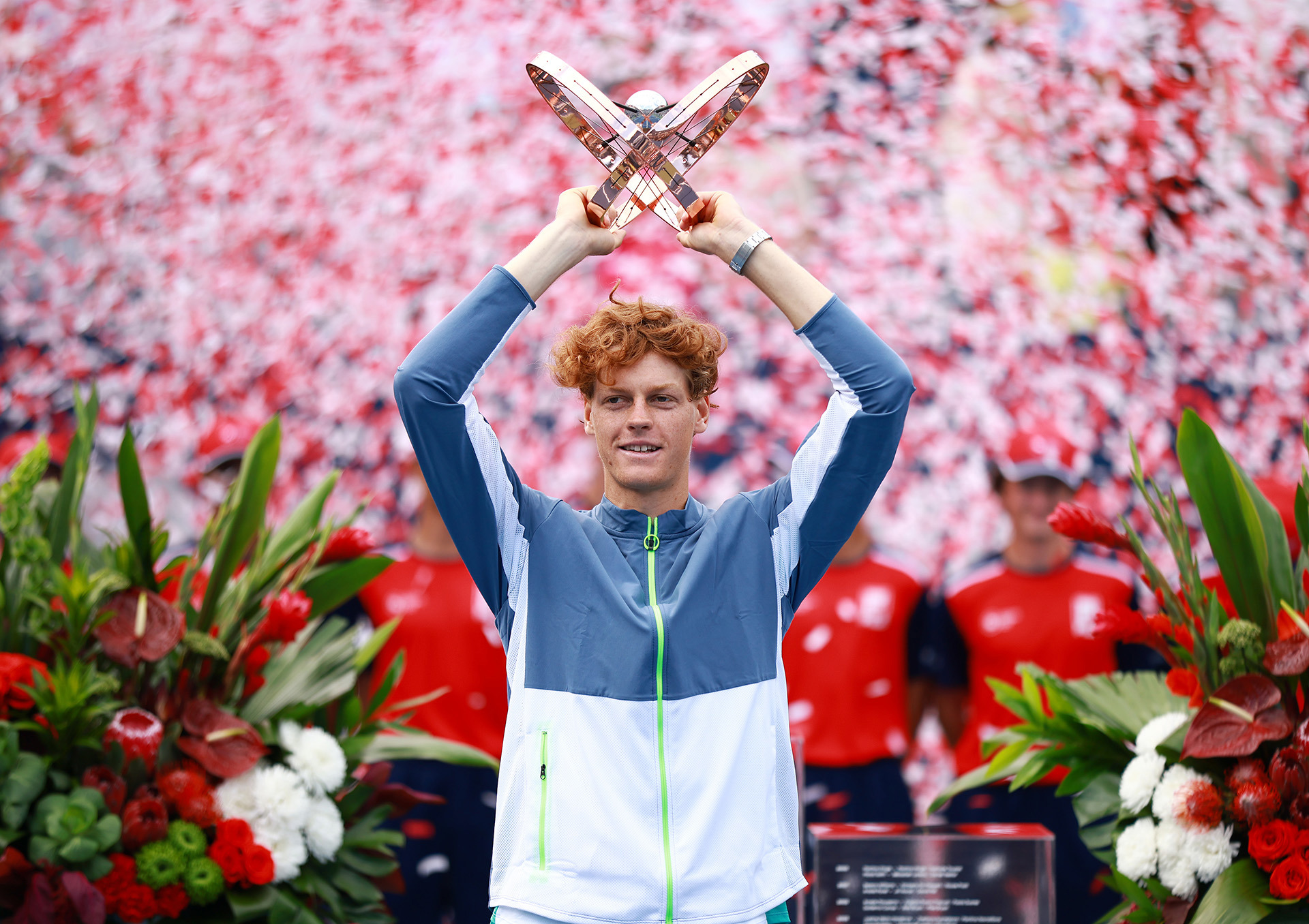 Jannik Sinner of Italy lifts the trophy after his win against Alex De Minaur of Australia in the Canadian Open.