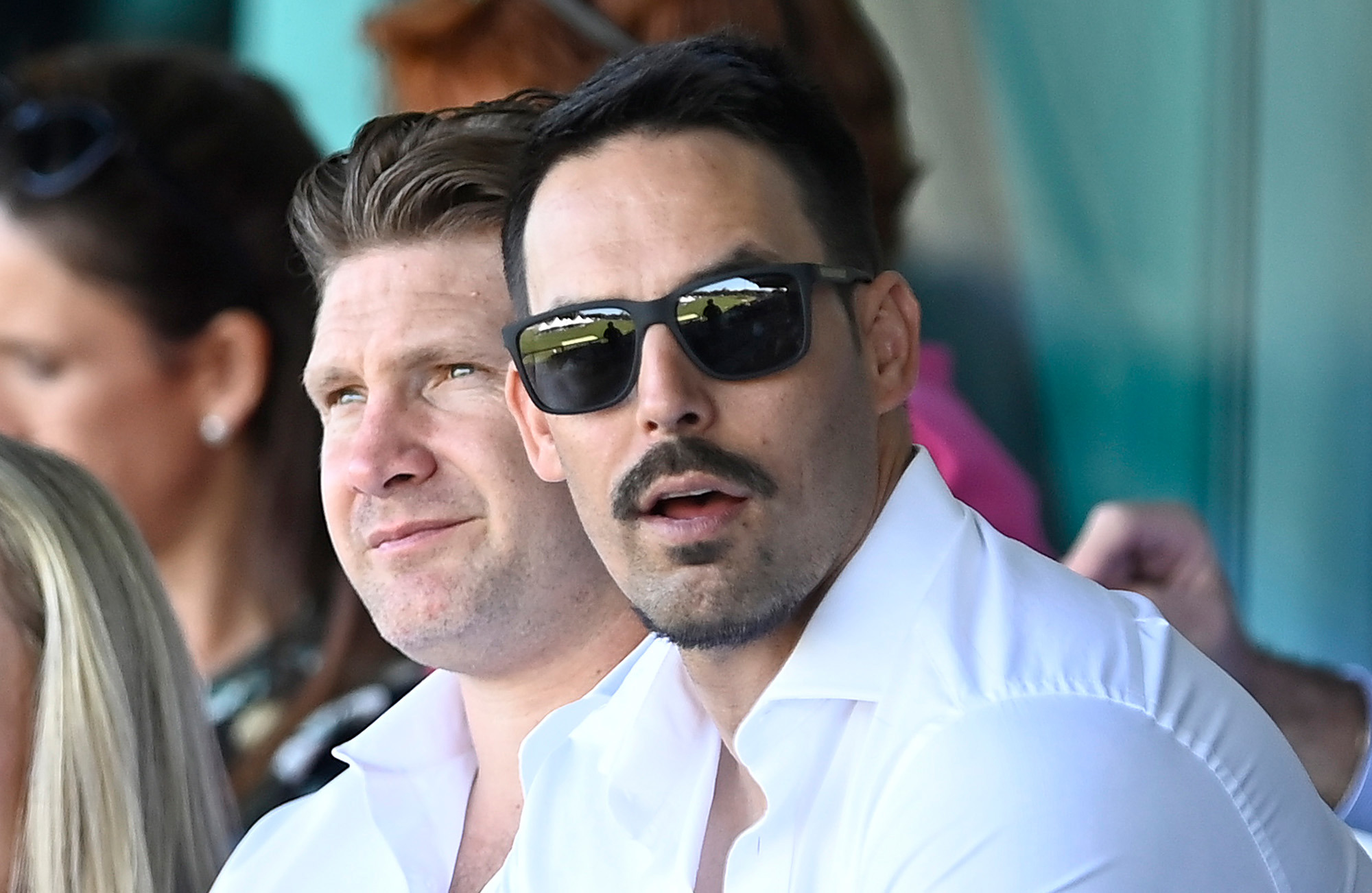 Mitchell Johnson sits with former teammate Shane Watson.