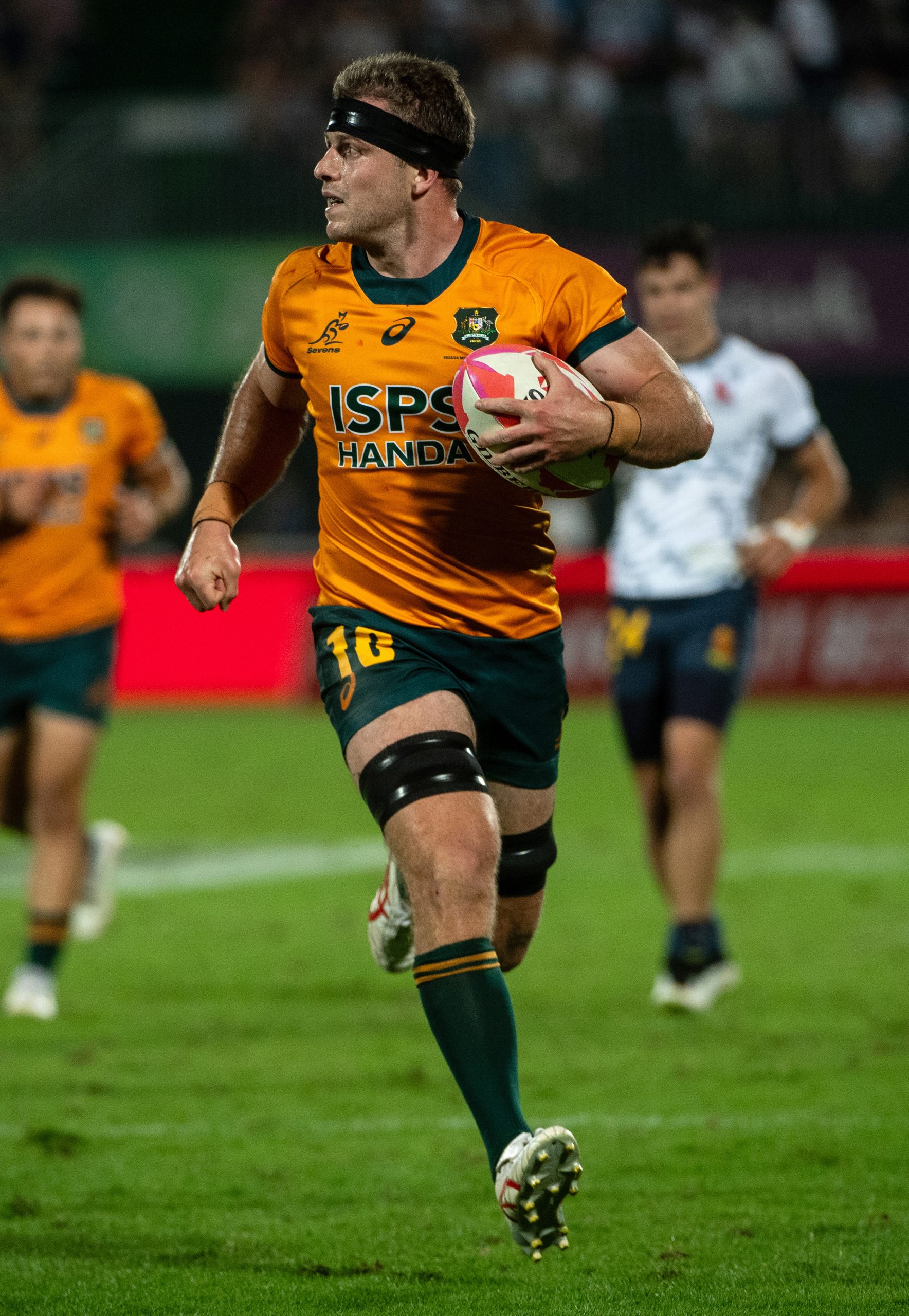 Nick Malouf of Australia runs to score a try against Spain.