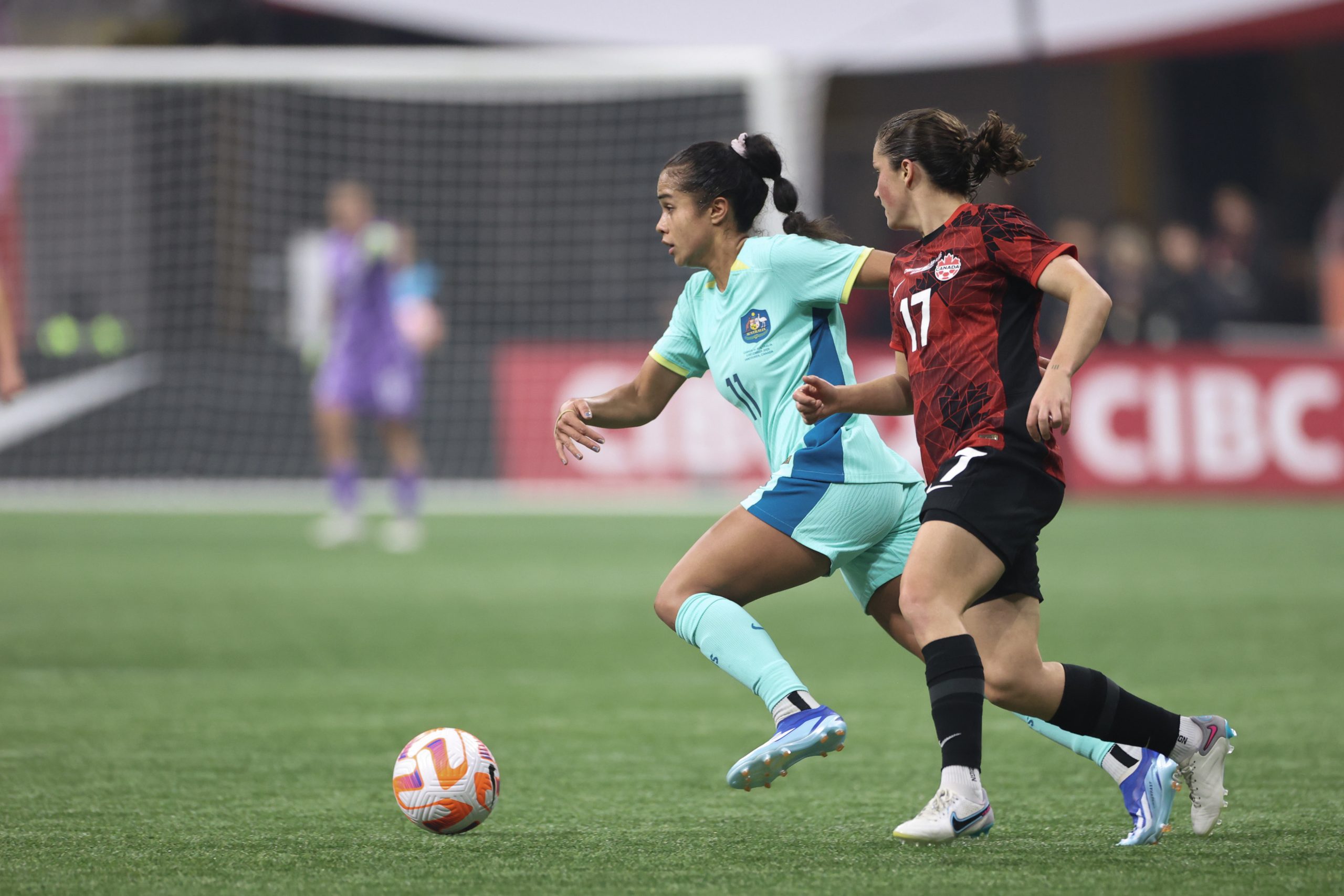 Mary Fowler controls the ball against Canada.