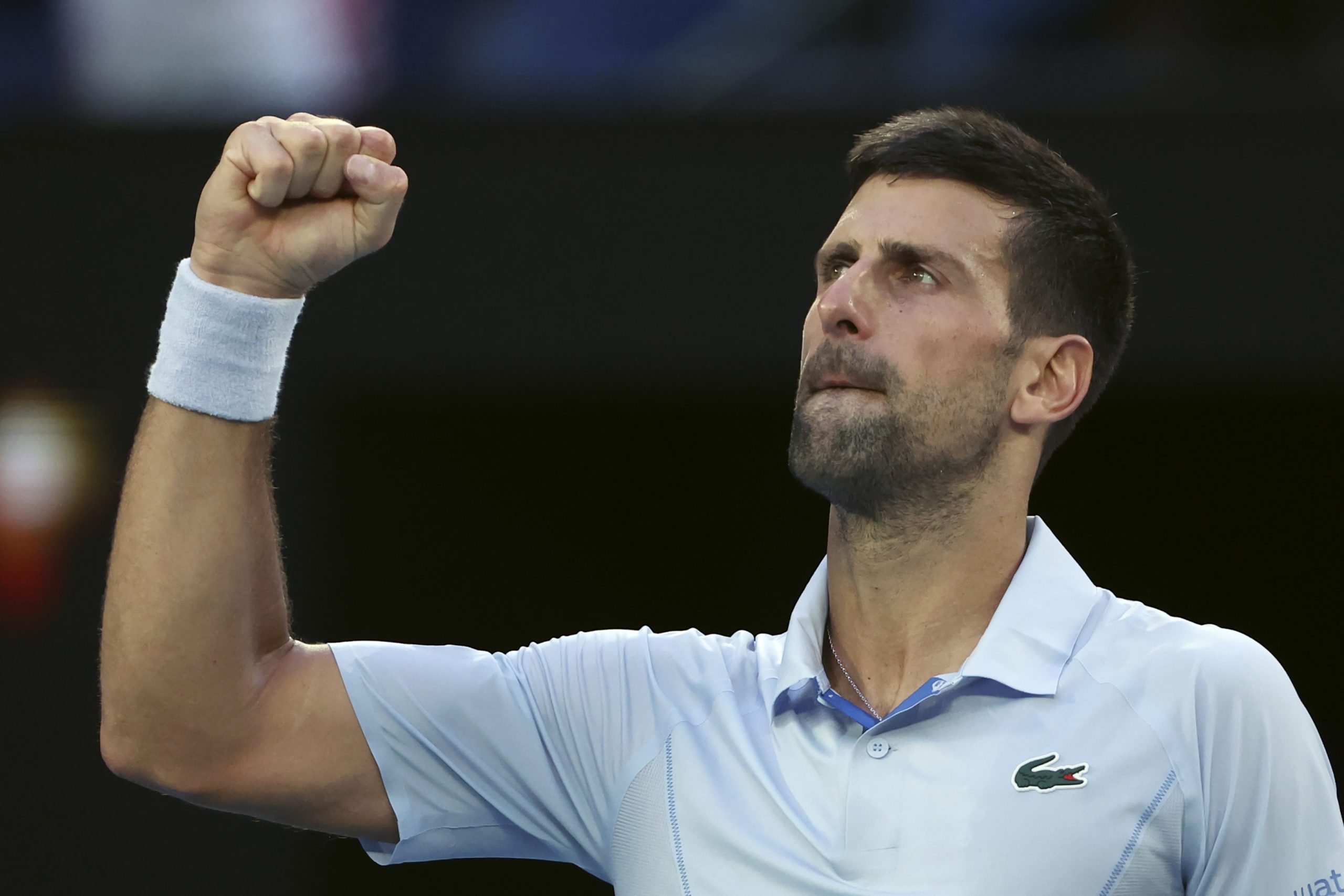 Novak Djokovic celebrates after defeating Taylor Fritz at the Australian Open.