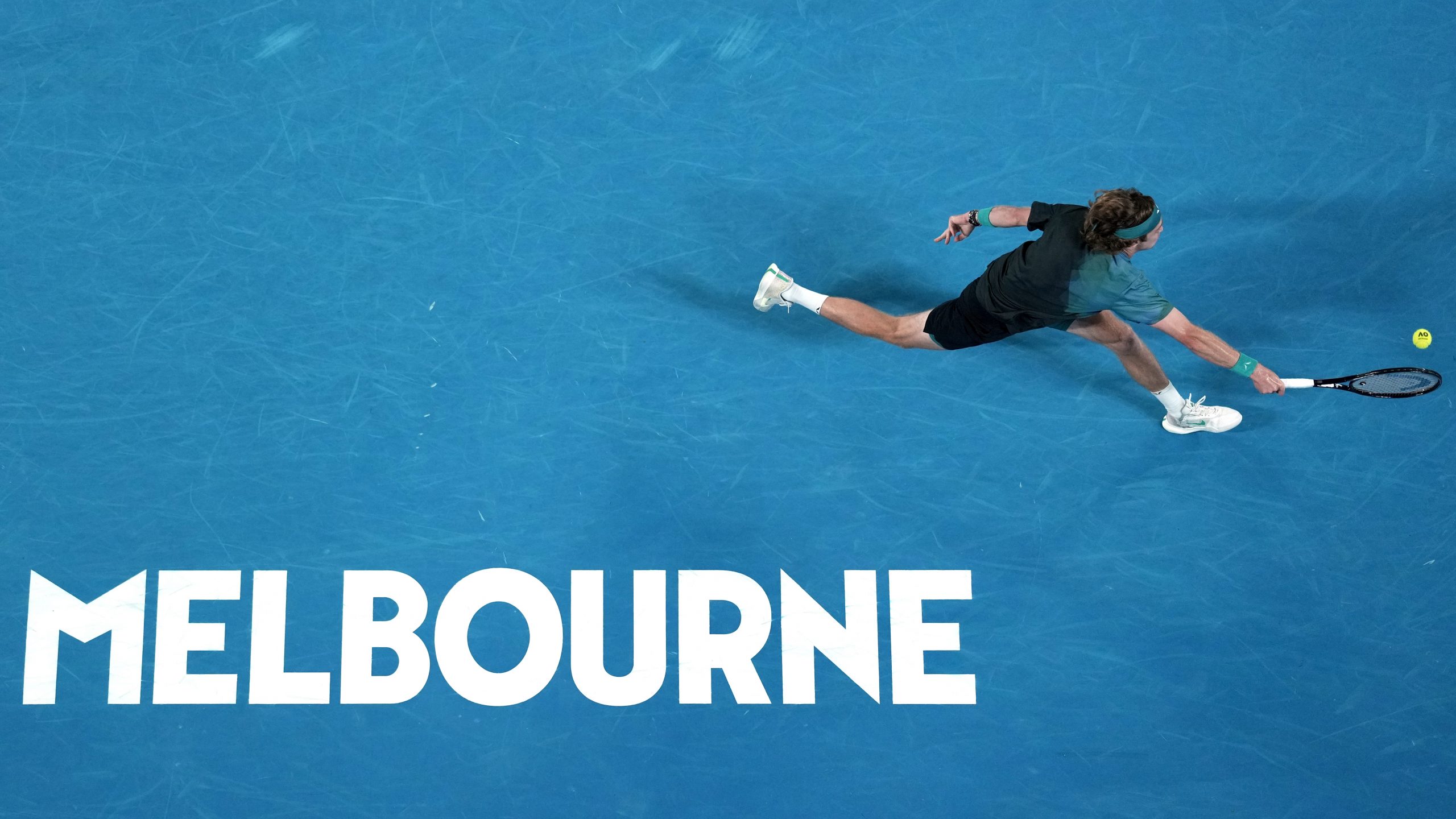 Andrey Rublev of Russia plays a forehand return to Jannik Sinner of Italy during their quarterfinal match at the Australian Open.