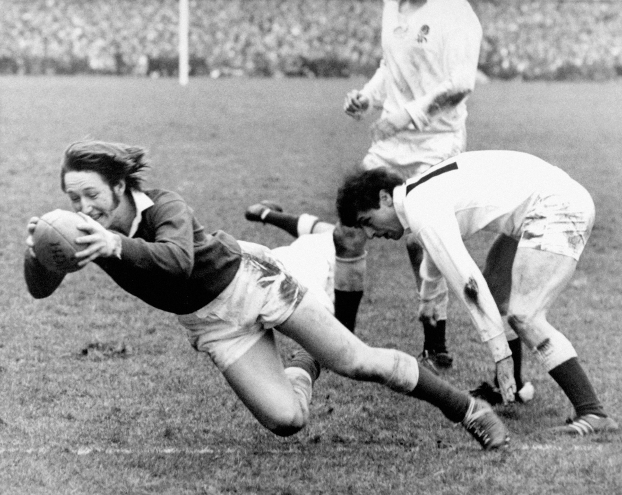 Wales' JPR Williams dives over to score a try.