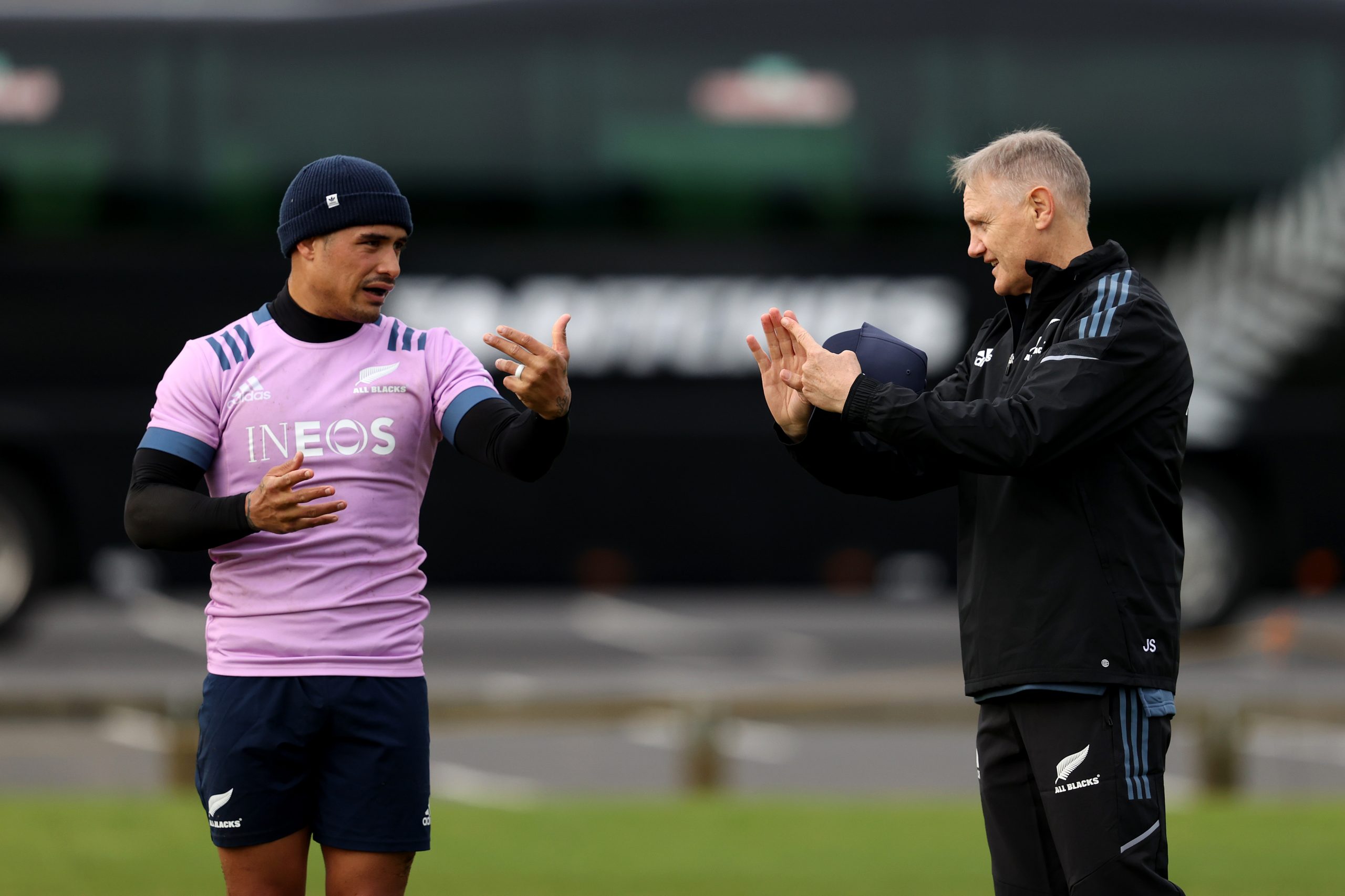 Assistant coach Joe Schmidt talks with Aaron Smith during All Blacks training.