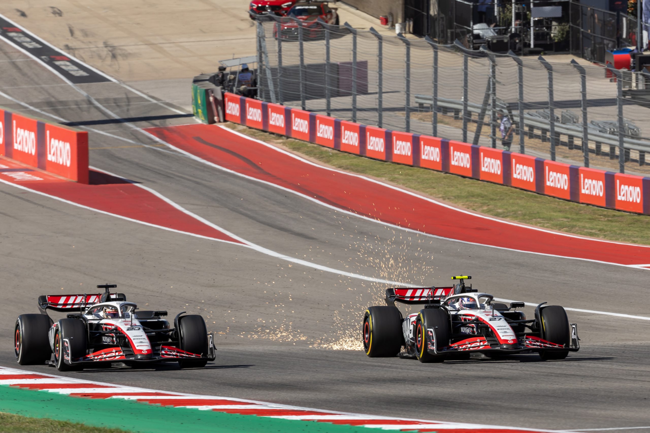 Kevin Magnussen (20) of Denmark and Nico Hulkenberg (27) of Germany speed up the main during the United States Grand Prix at Circuit of the Americas.