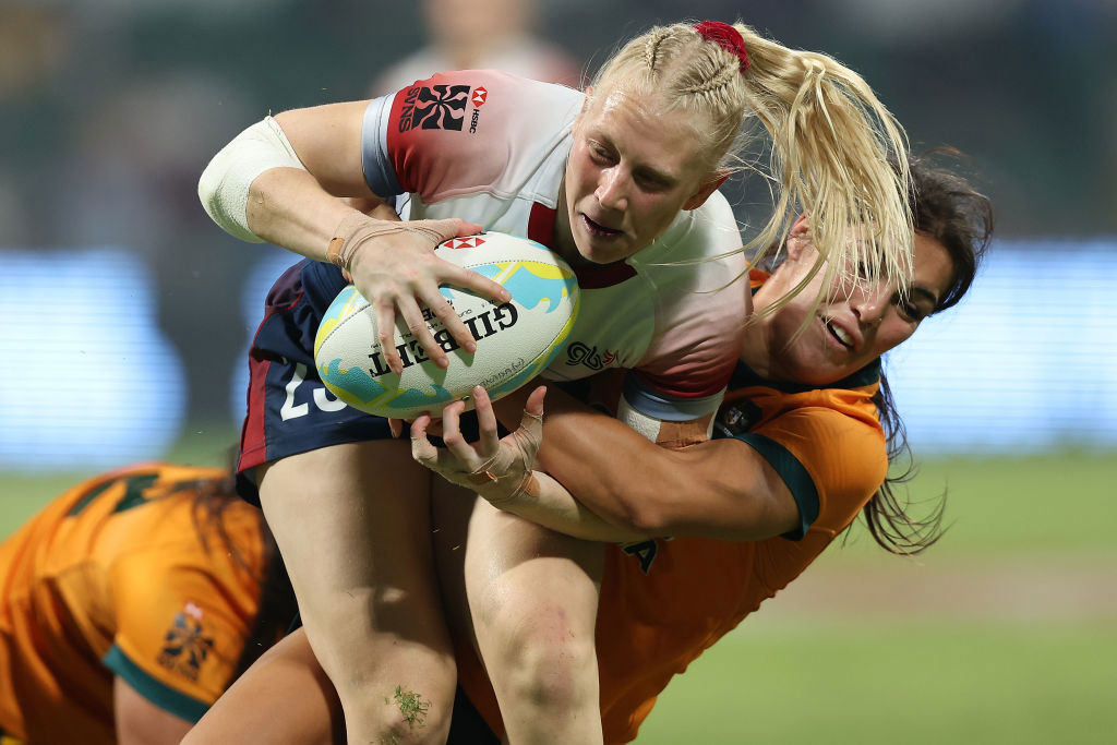 Heather Cowell of Great Britain gets tackled by Madison Ashby of Australia.