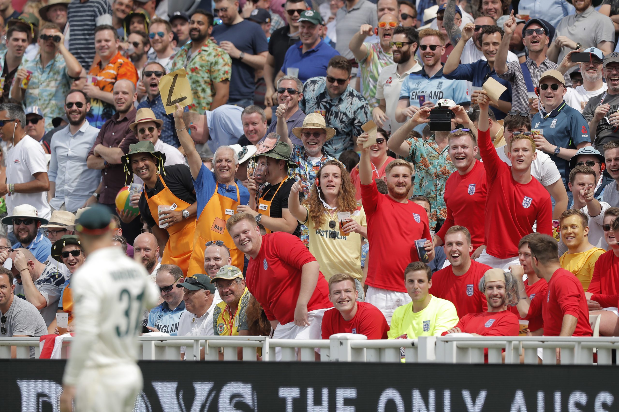 England fans in the Hollies Stand wave pieces of sandpaper at David Warner during The Ashes in 2019.