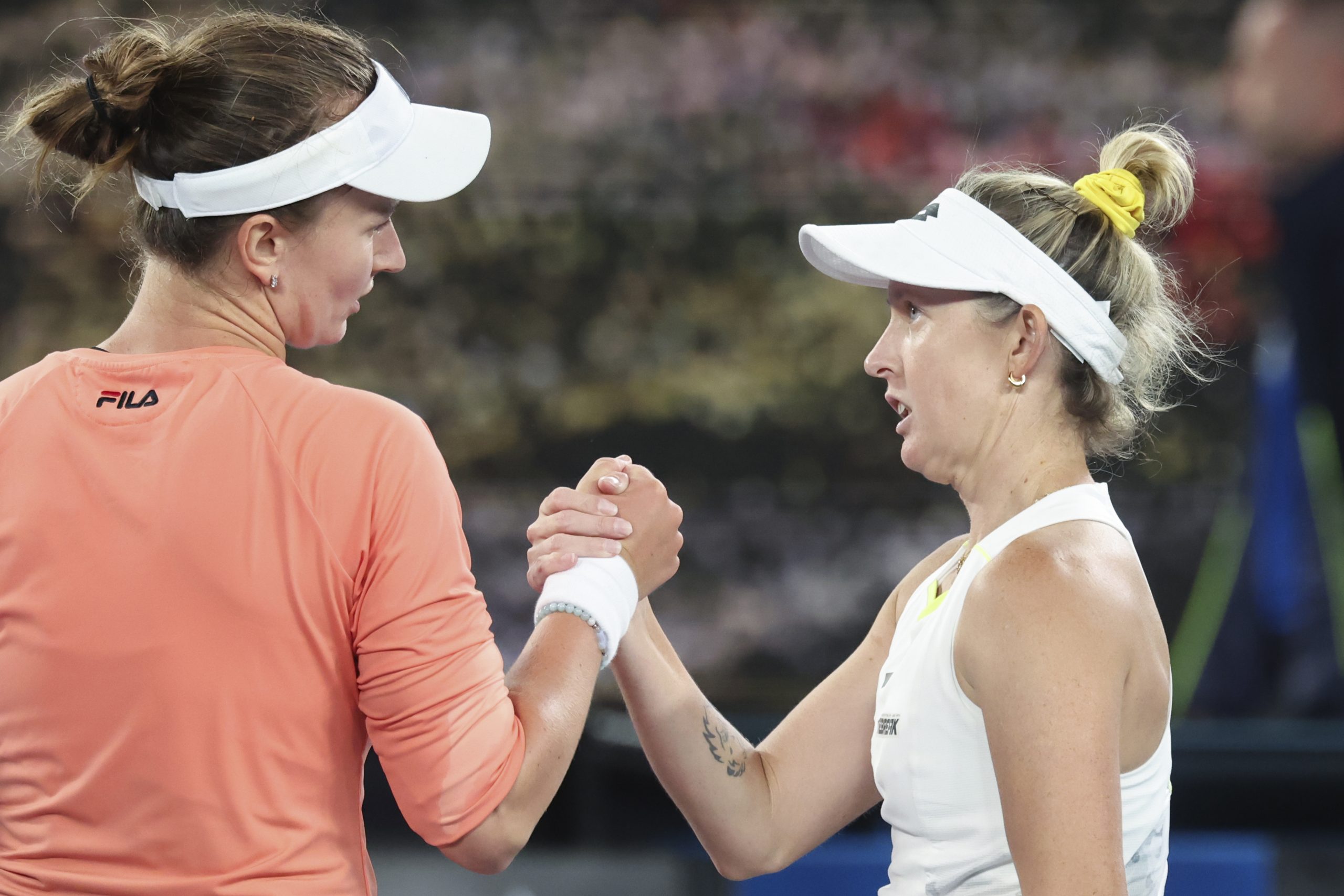 Barbora Krejcikova, left, of the Czech Republic is congratulated by Storm Hunter of Australia.