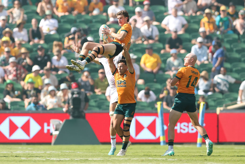 Hayden Sargeant of Australia receives the ball.