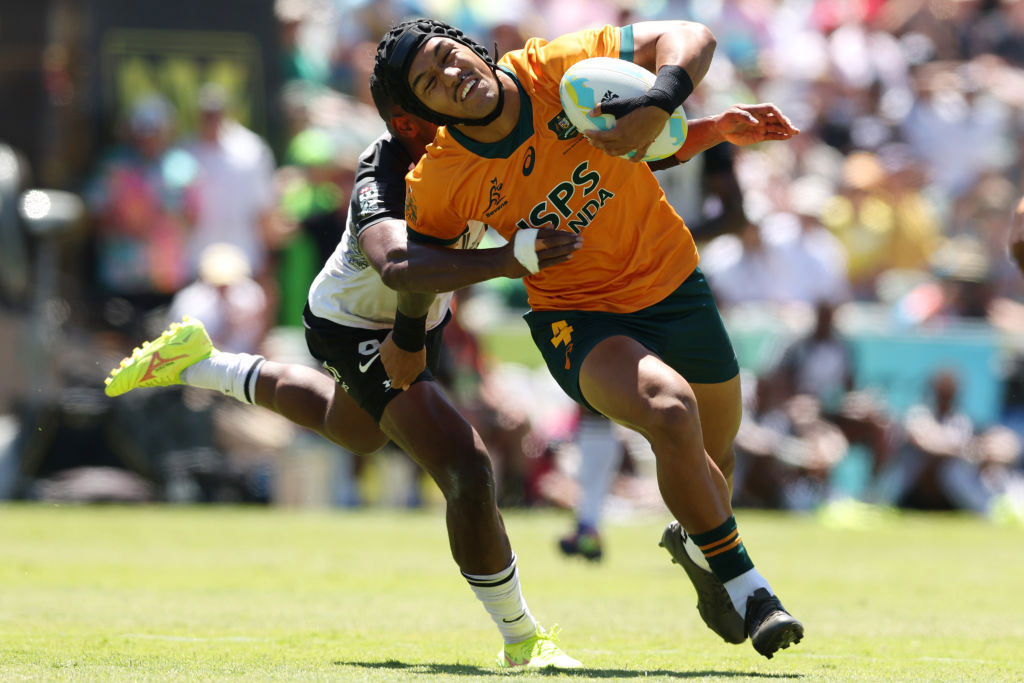 Dietrich Roache of Australia is tackled at HBF Park.