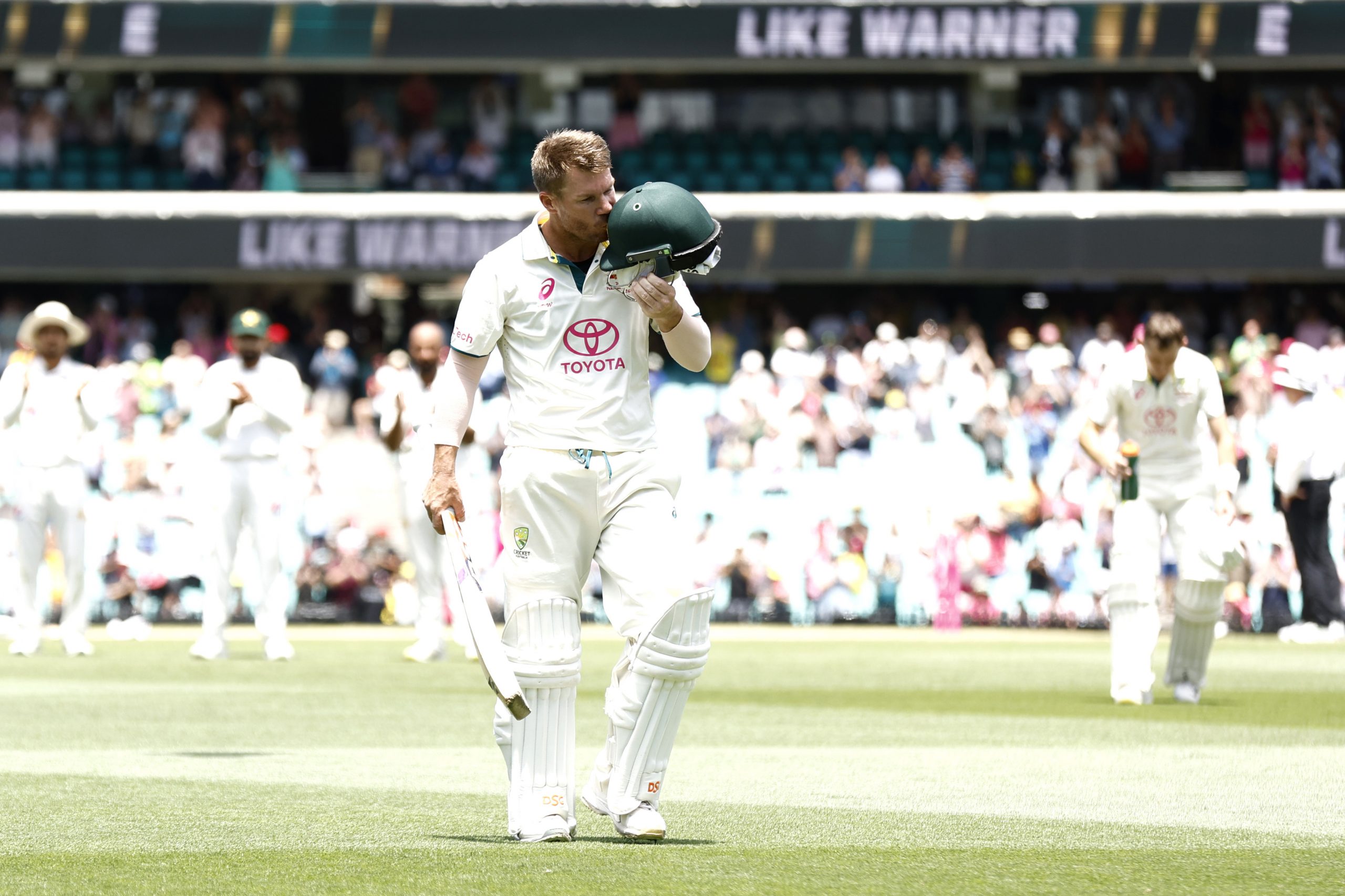 David Warner of Australia kisses his helmet after being dismissed by Sajid Khan of Pakistan in his final innings during day four of the Men's Third Test Match in the series between Australia and Pakistan at Sydney Cricket Ground on January 06, 2024 in Sydney, Australia. (Photo by Darrian Traynor/Getty Images)
