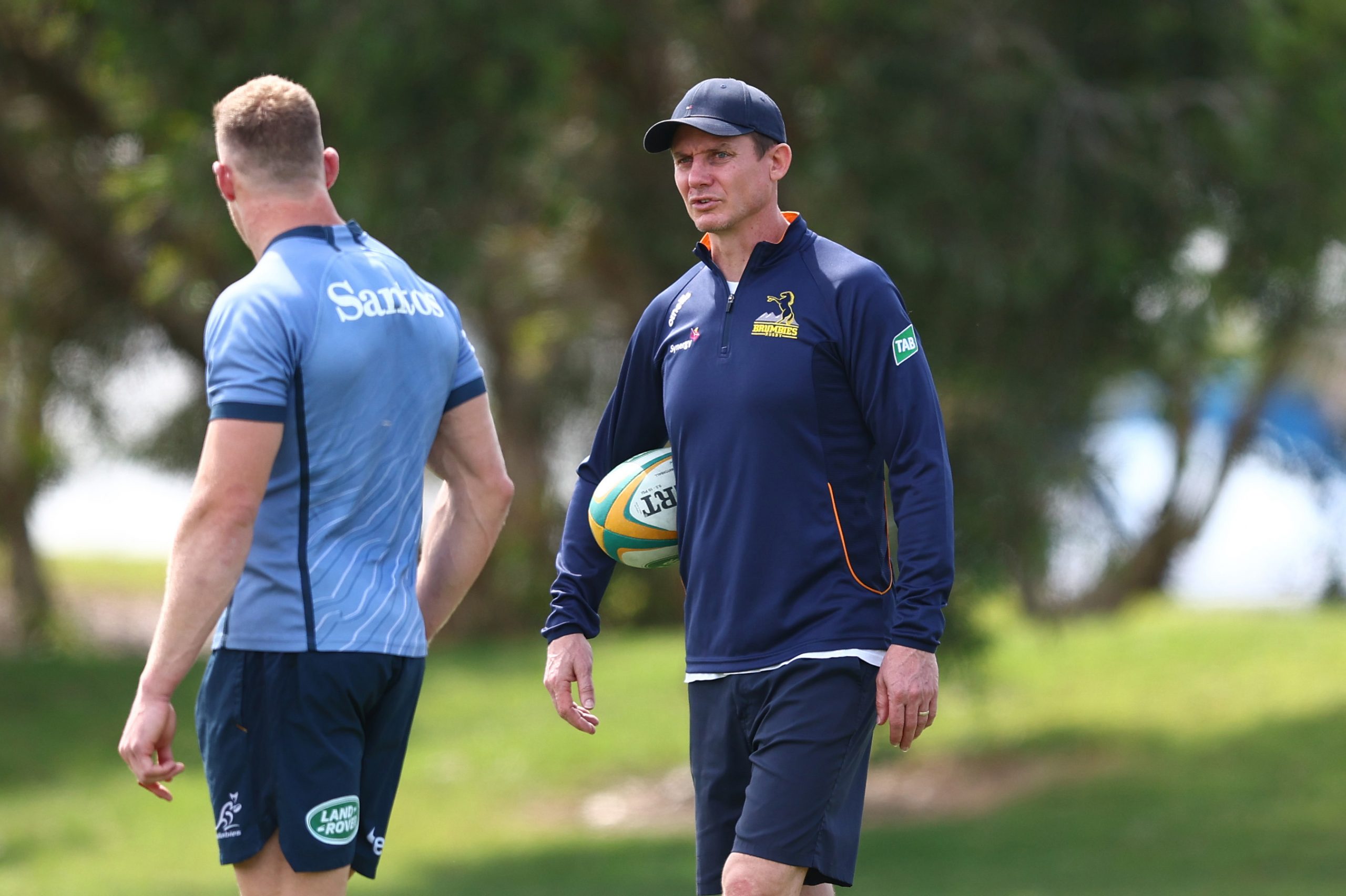 Stephen Larkham talks to Reece Hodge during Wallabies training.