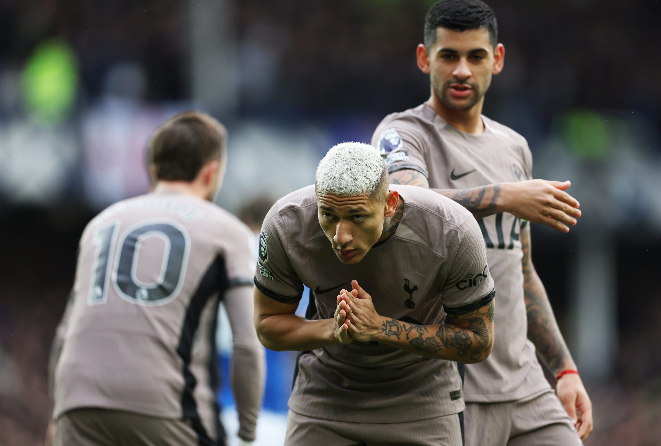 Richarlison of Tottenham Hotspur celebrates scoring his team's first goal asking for forgiveness from the Everton fans during the Premier League match between Everton FC and Tottenham Hotspur at Goodison Park on February 03, 2024 in Liverpool, England. (Photo by Clive Brunskill/Getty Images)