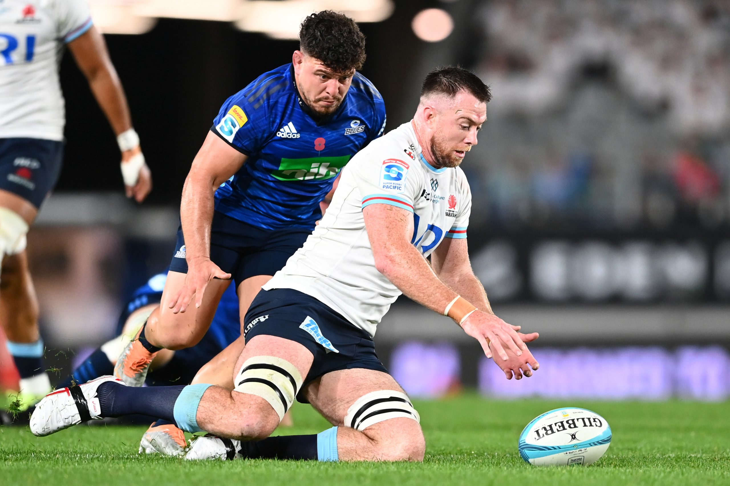 Jed Holloway of the Waratahs chases the ball down at Eden Park.