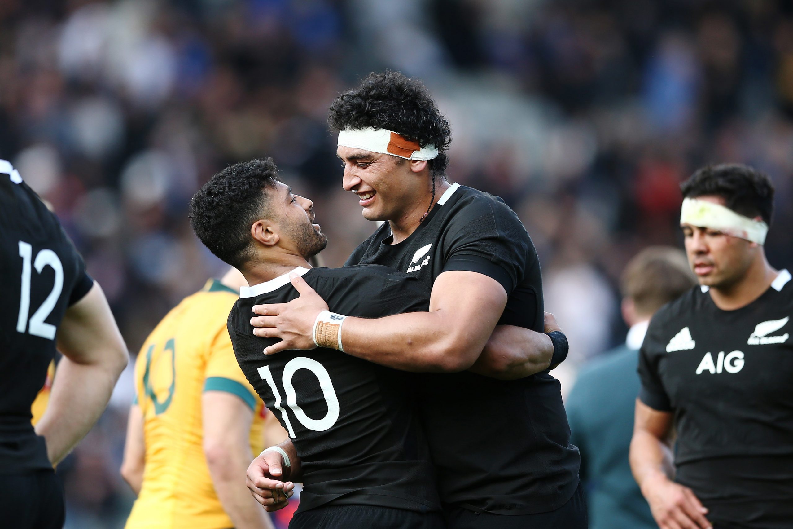 Alex Hodgman and Richie Mo'unga of the All Blacks celebrate winning a Bledisloe Cup match.