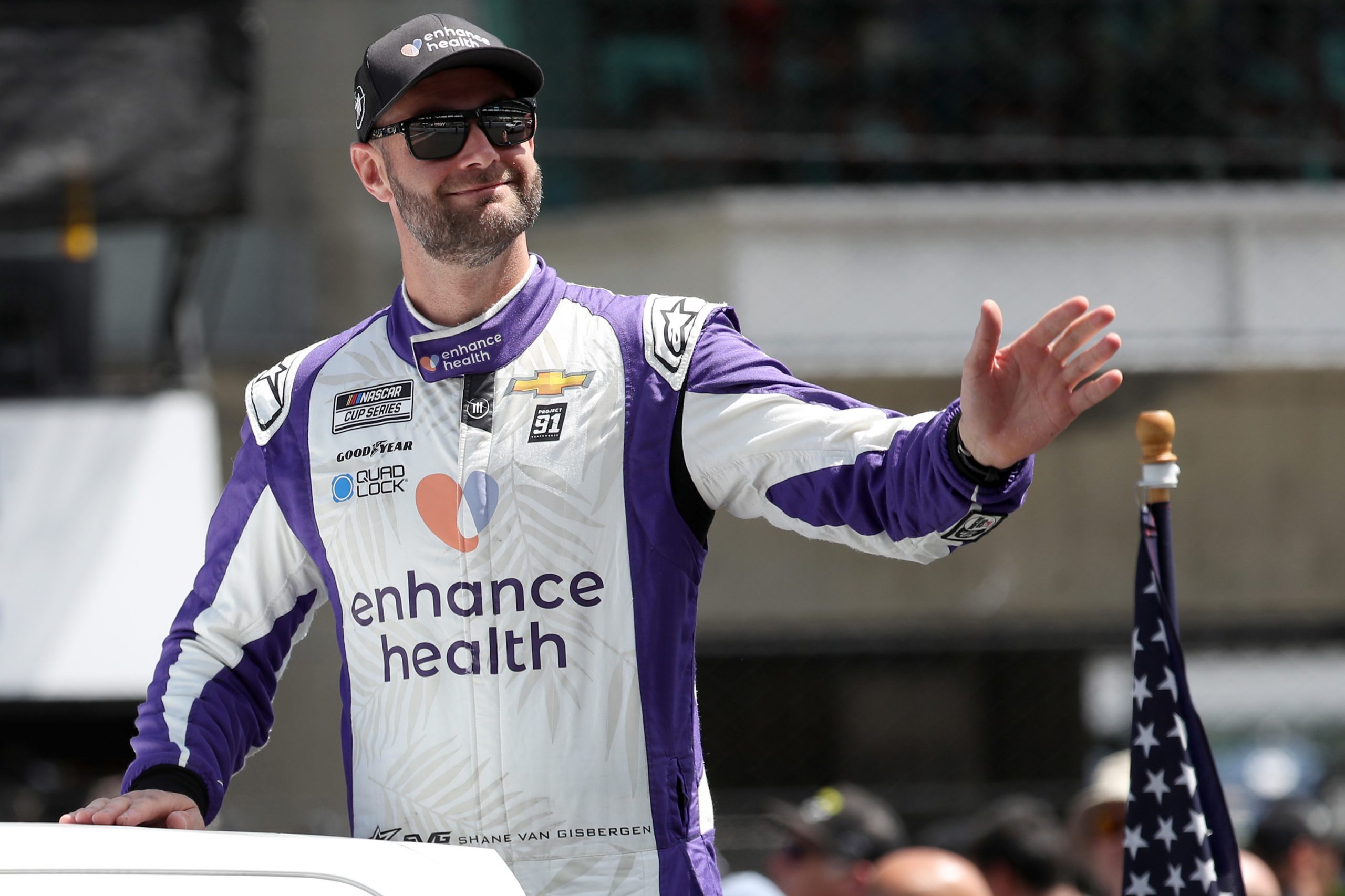 Shane Van Gisbergen, driver of the No.91 Chevrolet, waves to fans during the parade lap prior to the NASCAR Cup Series race at the Brickyard at Indianapolis Motor Speedway.