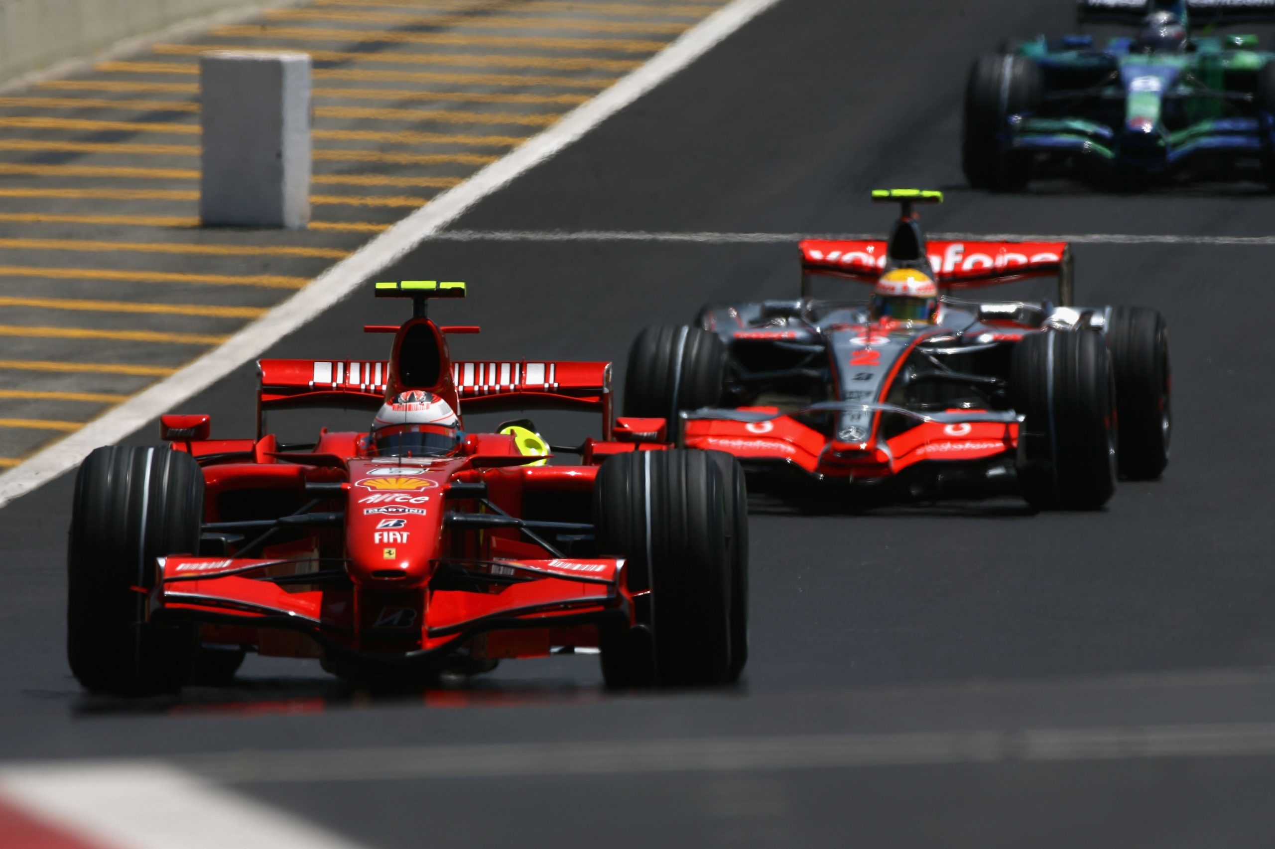Kimi Raikkonen of Finland and Ferrari leads from Lewis Hamilton of Great Britain and McLaren Mercedes in action during the warm up session prior to qualifying for the Brazilian Formula One Grand Prix at the Autodromo Interlagos on October 20, 2007 in Sao Paulo, Brazil. (Photo by Paul Gilham/Getty Images)