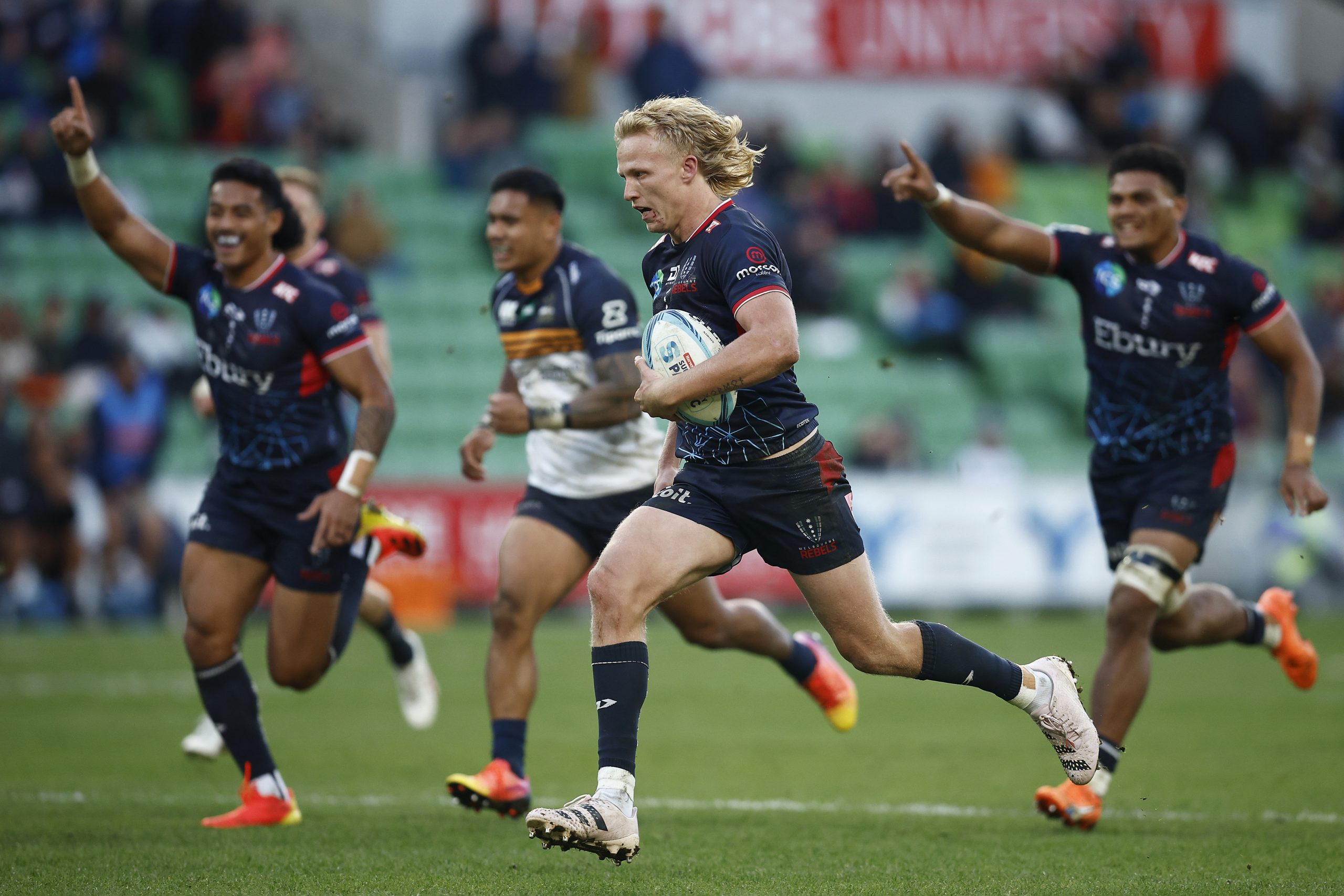 Carter Gordon runs to score a try for the Melbourne Rebels.