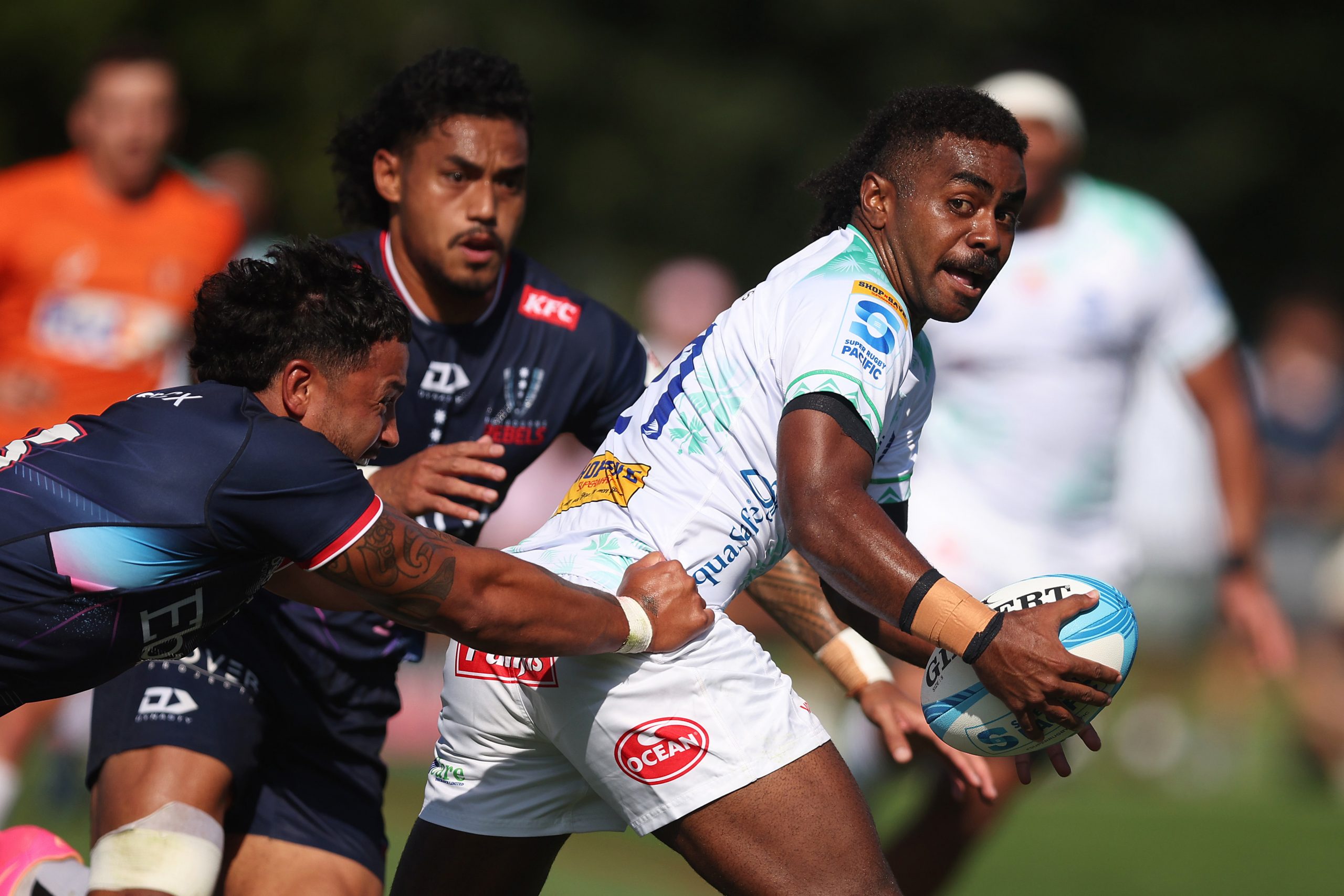 Simione Kuruvoli of Fijian Drua looks to pass the ball during the Super Rugby Pacific pre-season match agains the Melbourne Rebels.