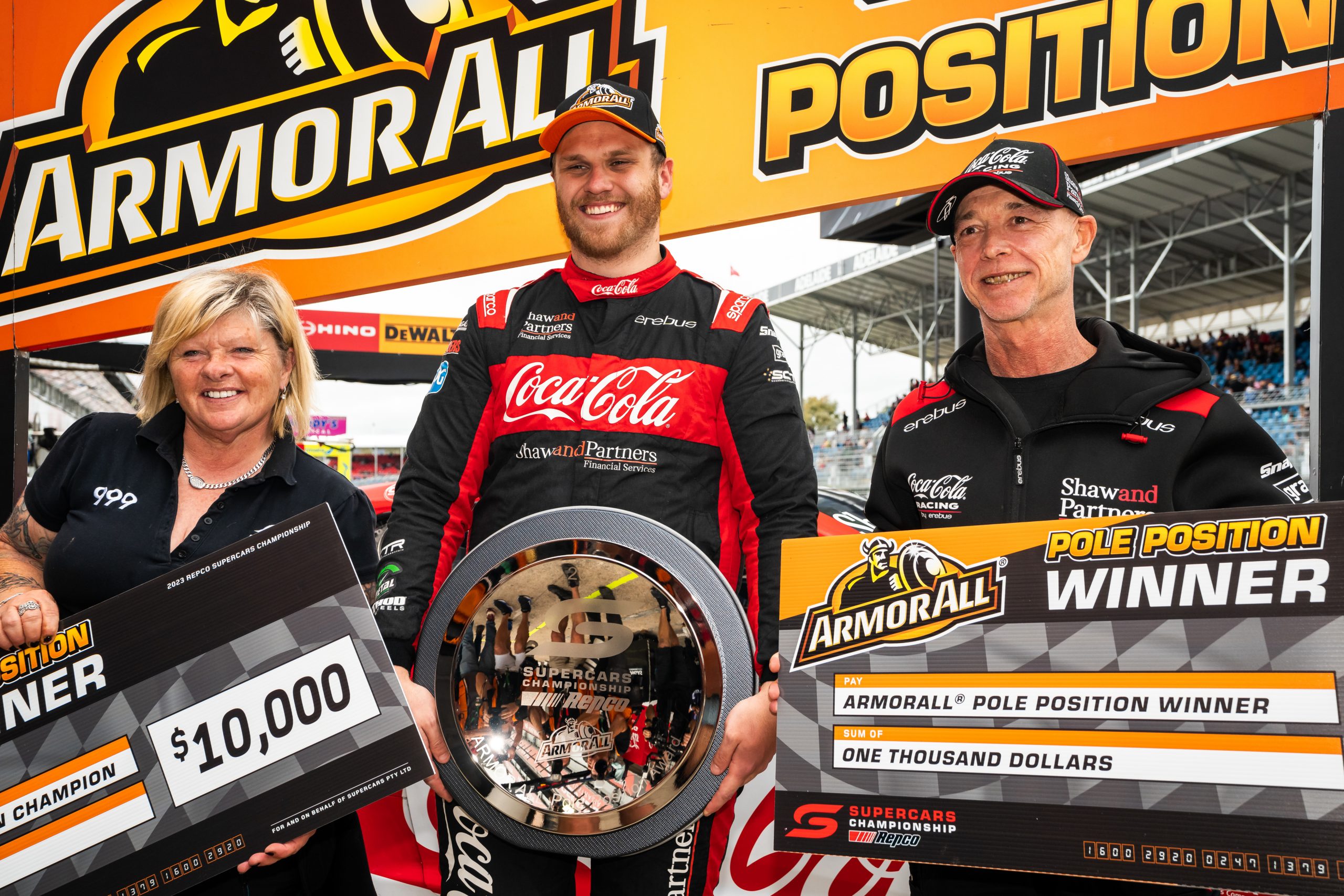 Erebus Motorsport owner Betty Klimenko (left) with Brodie Kostecki (centre) and Klimenko's husband Daniel (right). 