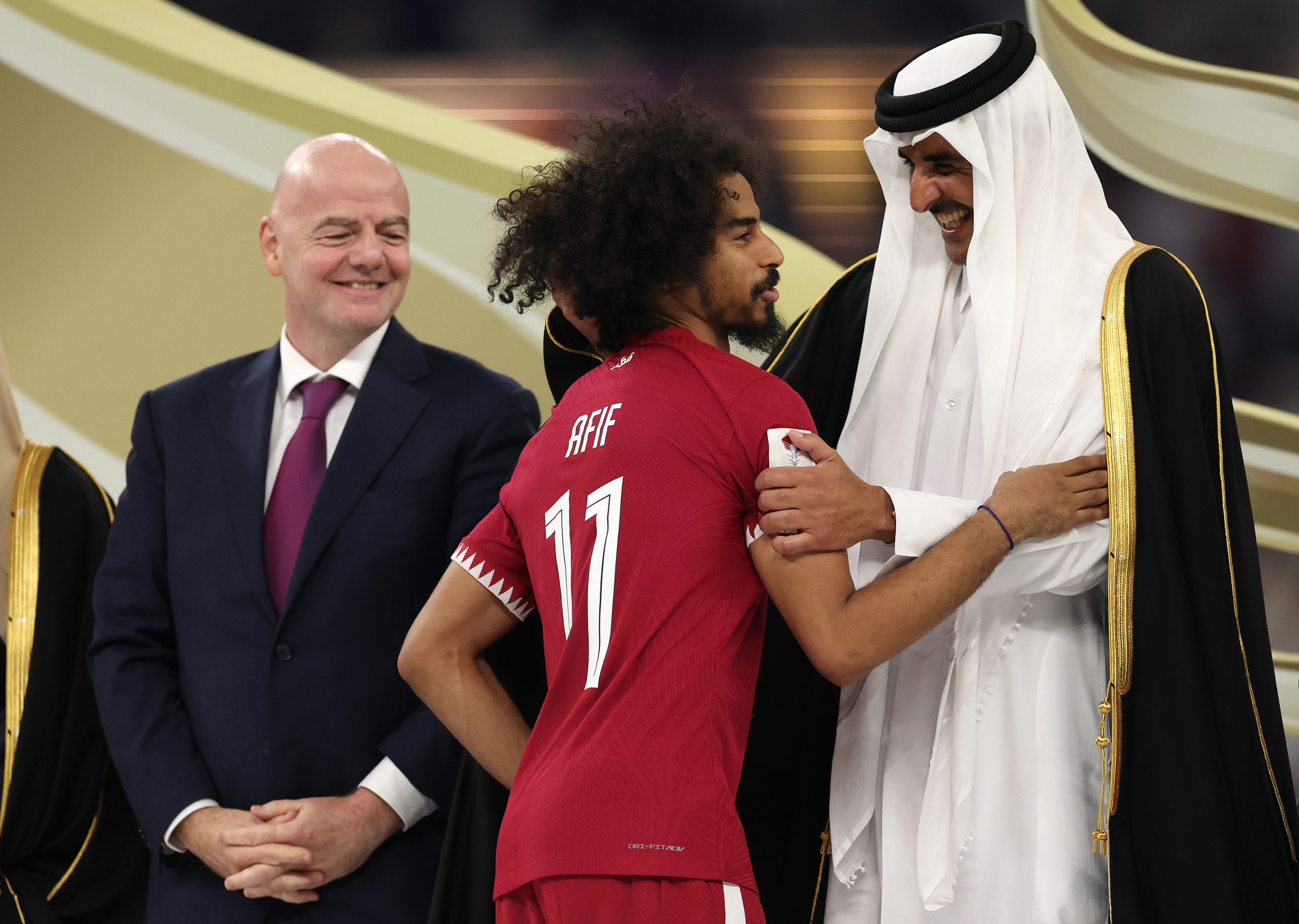 Akram Afif of Qatar interaqcts with Tamim bin Hamad Al Thani, Emir of Qatar after the AFC Asian Cup final match between Jordan and Qatar at Lusail Stadium on February 10, 2024 in Lusail City, Qatar. (Photo by Robert Cianflone/Getty Images)