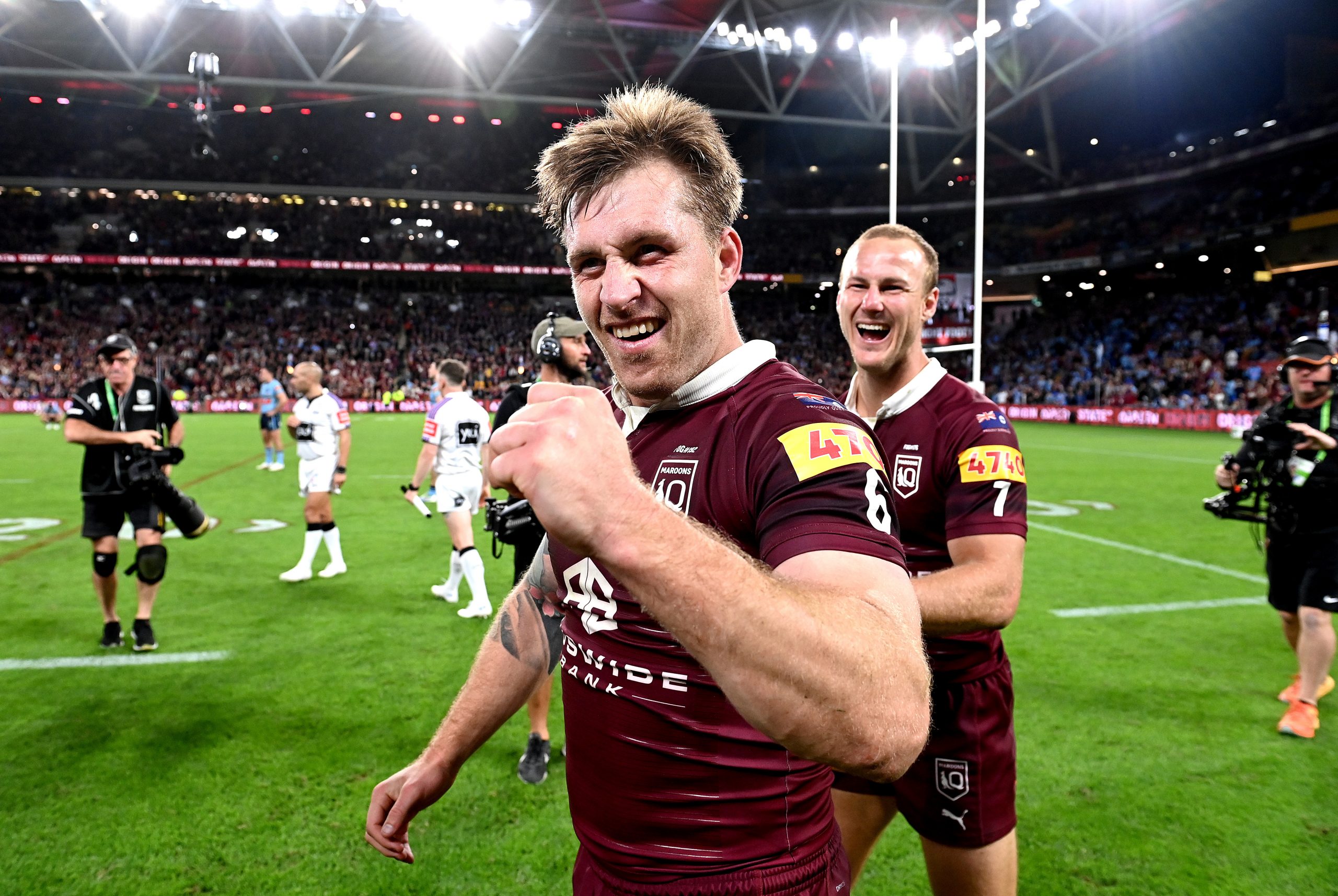 BRISBANE, AUSTRALIA - JUNE 21: Cameron Munster and Daly Cherry-Evans of Queensland celebrate victory after game two of the State of Origin series between the Queensland Maroons and the New South Wales Blues at Suncorp Stadium on June 21, 2023 in Brisbane, Australia. (Photo by Bradley Kanaris/Getty Images)