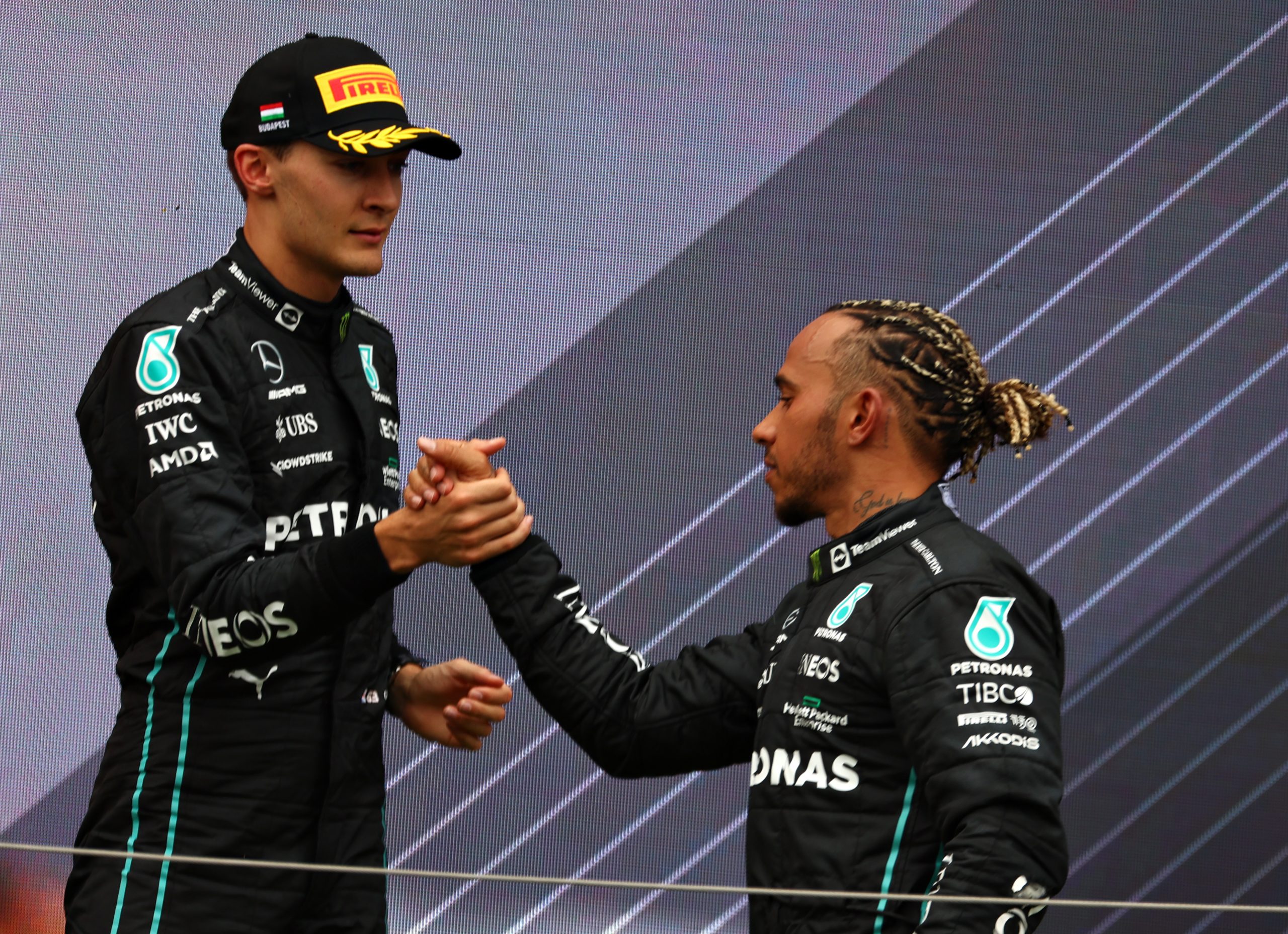 Lewis Hamilton and George Russell on the podium after the F1 Grand Prix of Hungary at Hungaroring on July 31, 2022 in Budapest, Hungary. (Photo by Bryn Lennon - Formula 1/Formula 1 via Getty Images)