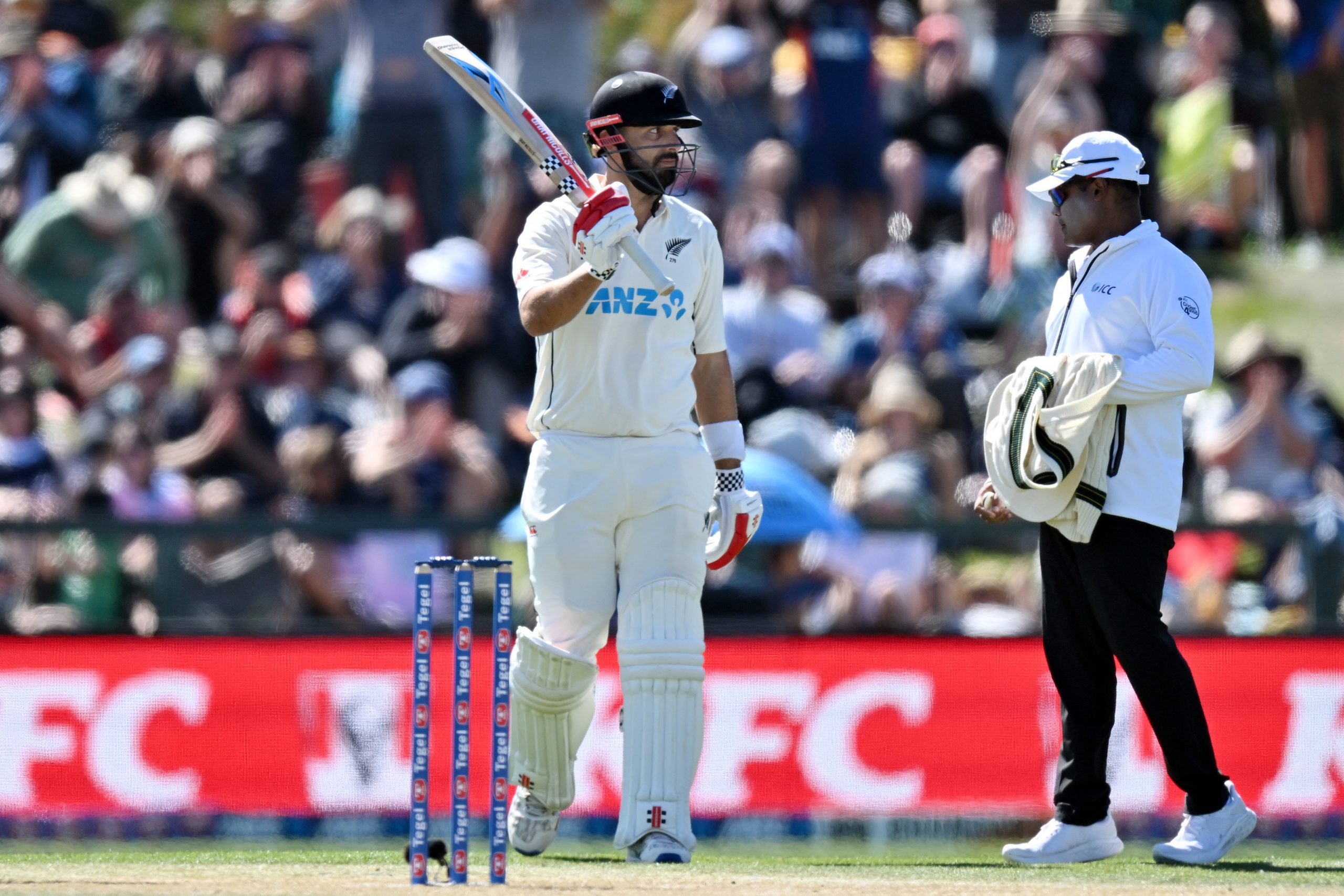 Daryl Mitchell of New Zealand celebrates his half century during day three of the Second Test in the series between New Zealand and Australia at Hagley Oval on March 10, 2024 in Christchurch, New Zealand. (Photo by Kai Schwoerer/Getty Images)