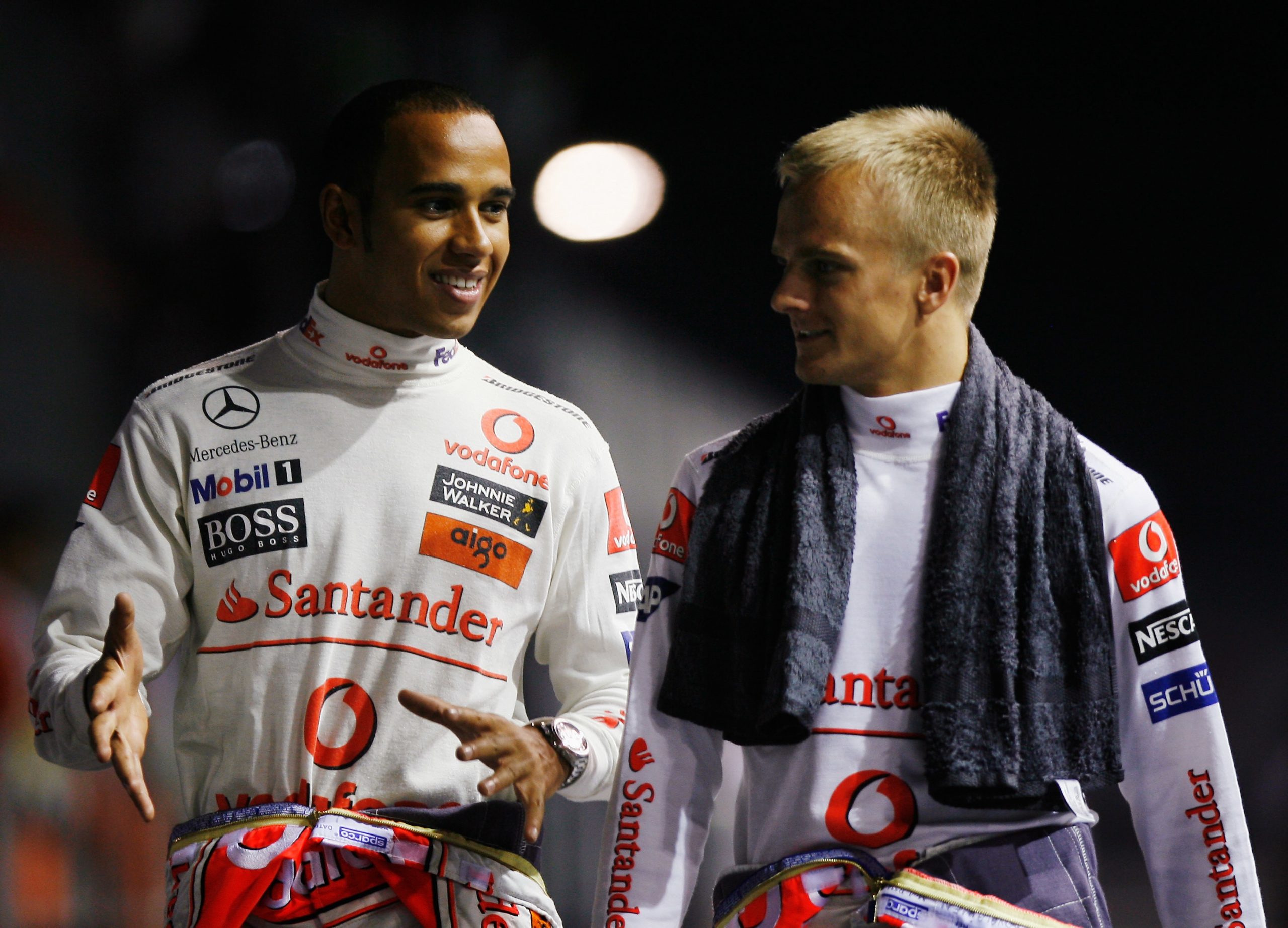 Lewis Hamilton (left) and then-McLaren teammate Heikki Kovalainen at the 2008 Singapore Grand Prix.