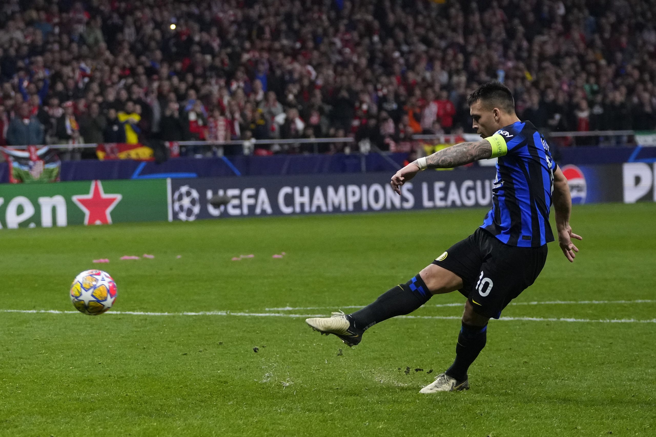 Inter Milan's Lautaro Martinez misses in the penalty shootout during the Champions League, round of 16, second leg soccer match between Atletico Madrid and Inter Milan at the Metropolitano stadium in Madrid.