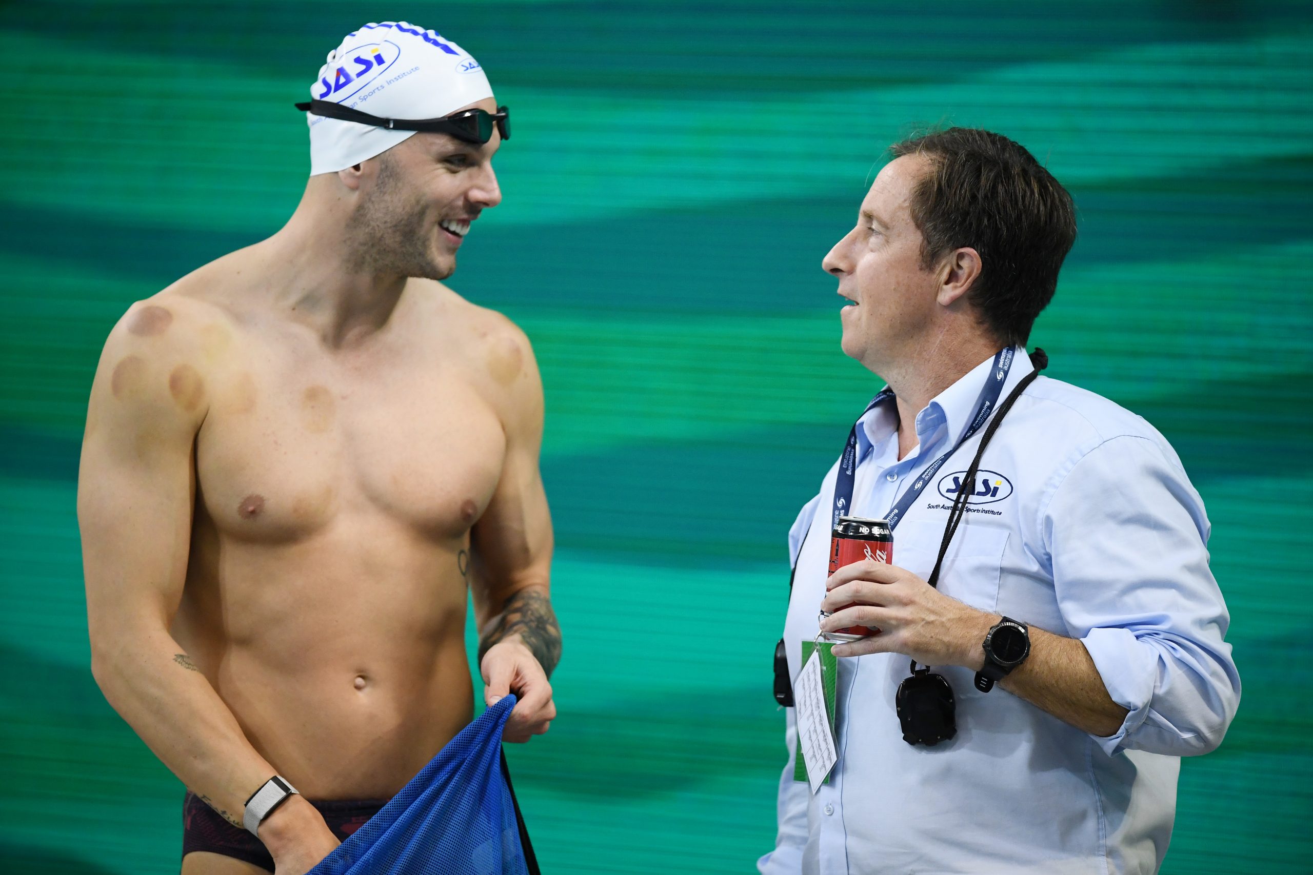 Kyle Chalmers  chats to SASI coach Peter Bishop during the warm-up session of the Australian National Olympic Swimming Trials at SA Aquatic & Leisure Centre on June 17, 2021 in Adelaide, Australia. (Photo by Mark Brake/Getty Images)