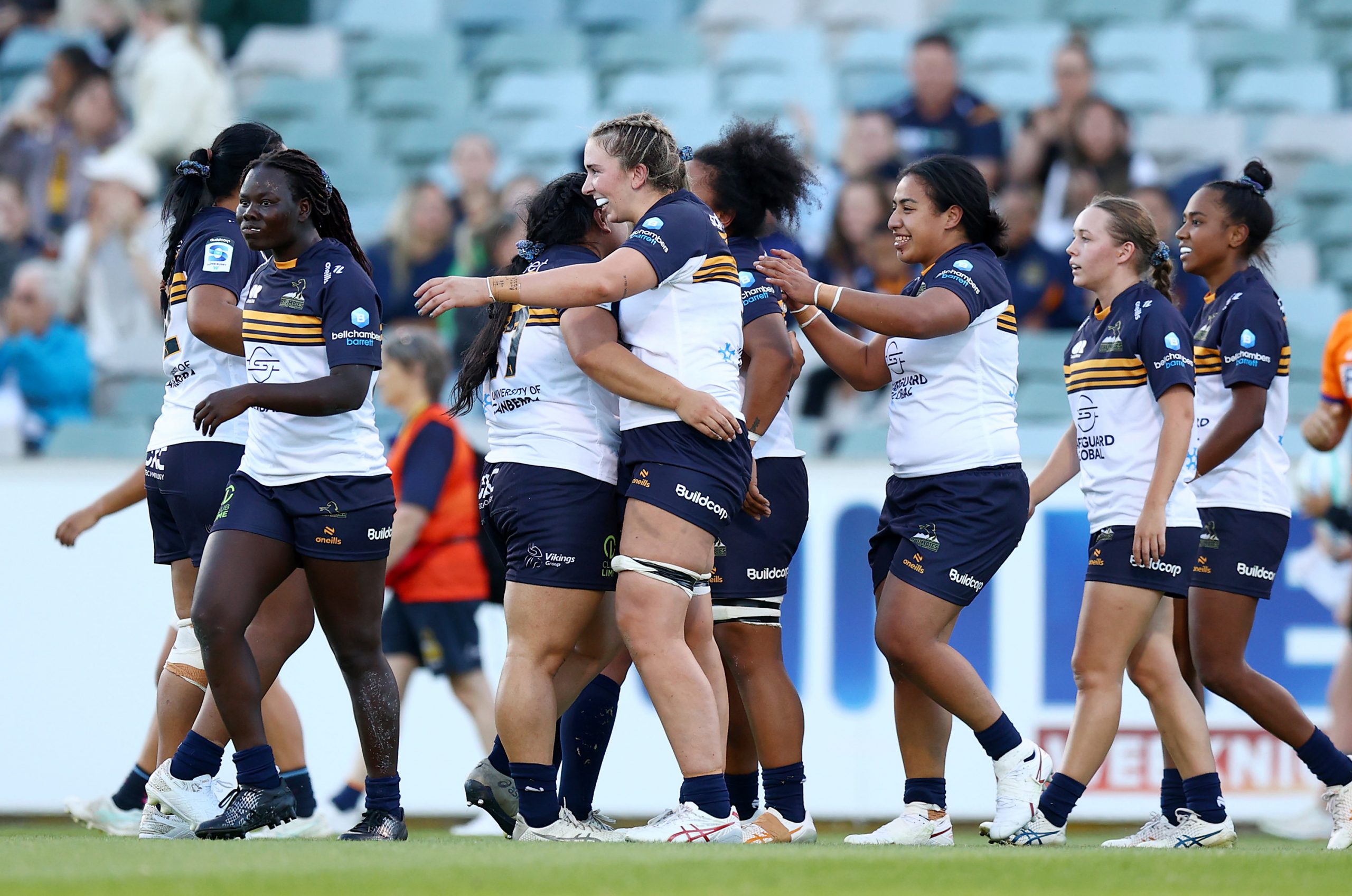Brumbies players celebrate winning the round two Super Rugby Women's match between ACT Brumbies and Melbourne Rebels.