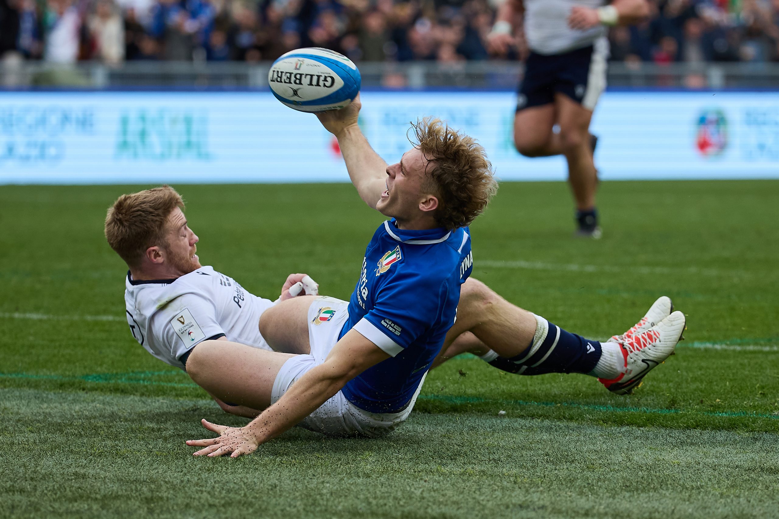 Louis Lynagh of Italy celebrates after scoring a try.